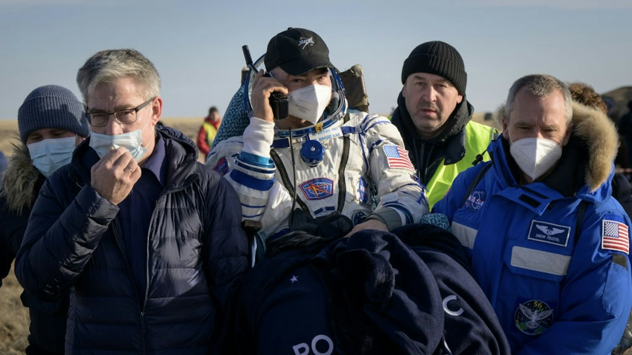 Expedition 66 Soyuz Landing ZHEZKAZGAN, KAZAKHSTAN - MARCH 30: In this handout image provided by the U.S. National Aeronatics and Space Administration (NASA), Expedition 66 NASA astronaut Mark Vande Hei is carried to a medical tent shortly after he and fellow crew mates Pyotr Dubrov and Anton Shkaplerov of Roscosmos landed in their Soyuz MS-19 spacecraft near the town of Zhezkazgan on March 30, 2022 in Zhezkazgan, Kazakhstan. Vande Hei and Dubrov are returning to Earth after logging 355 days in space as members of Expeditions 64-66 aboard the International Space Station. For Vande Hei, his mission is the longest single spaceflight by a U.S. astronaut in history. Shkaplerov is returning after 176 days in space, serving as a Flight Engineer for Expedition 65 and commander of Expedition 66. (Photo by Bill Ingalls/NASA/Getty Images) Bill Ingalls/NASA / Handout via Getty Images