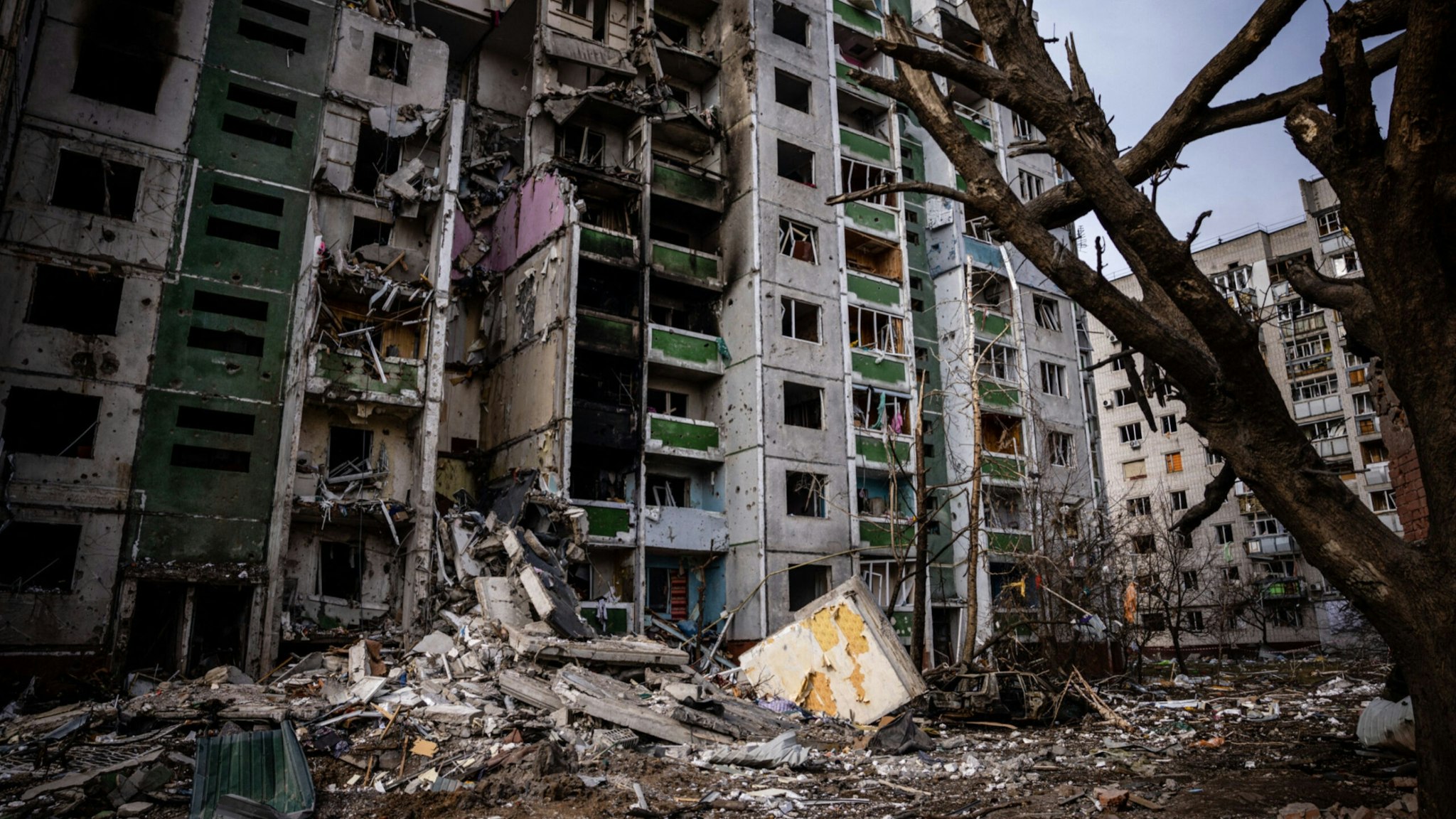This picture taken on March 4, 2022 shows a residential building damaged during a shelling the day before in the city of Chernihiv.