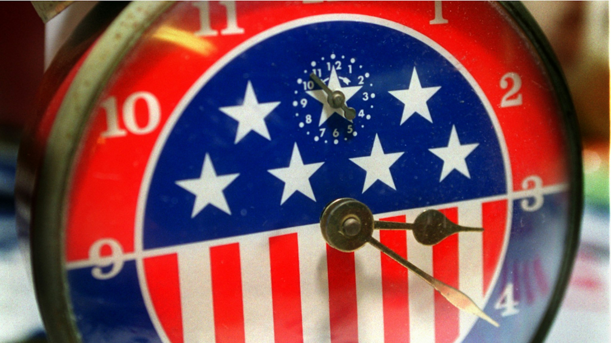 LS.Flag.Clock.DB.6/19/98.Orange.  Wind up alarm clock, 1940's  50's. $85.00. From the large collection of patriotic home decorating memorabilia at American Roots, an antique store on W. Chapman in Orange