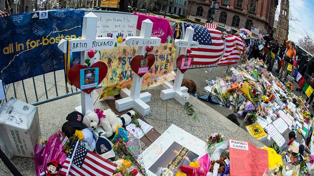 Crosses memorializing Boston Marathon bombing victims Martin Richard, Lu Lingzi and Krystie Cambell at a memorial to all victims of the Boston Marathon bombing at the the corner of Boylston and Berkley St in Boston, MA on April 18, 2013. 3 people died and and at least 180 were injured.