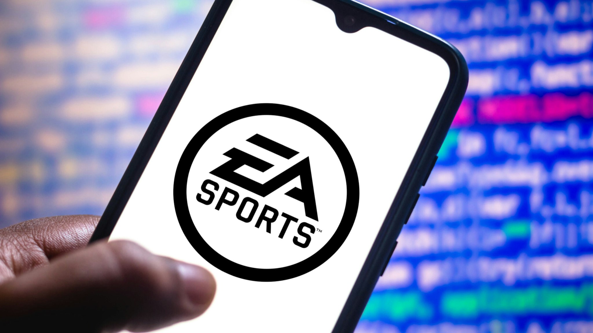 In this photo illustration the EA Sports logo seen displayed on a smartphone screen.