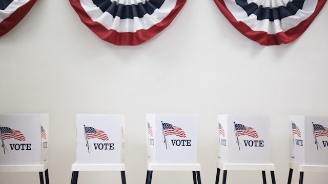 Voting booths in polling place Hill Street Studios via Getty Images