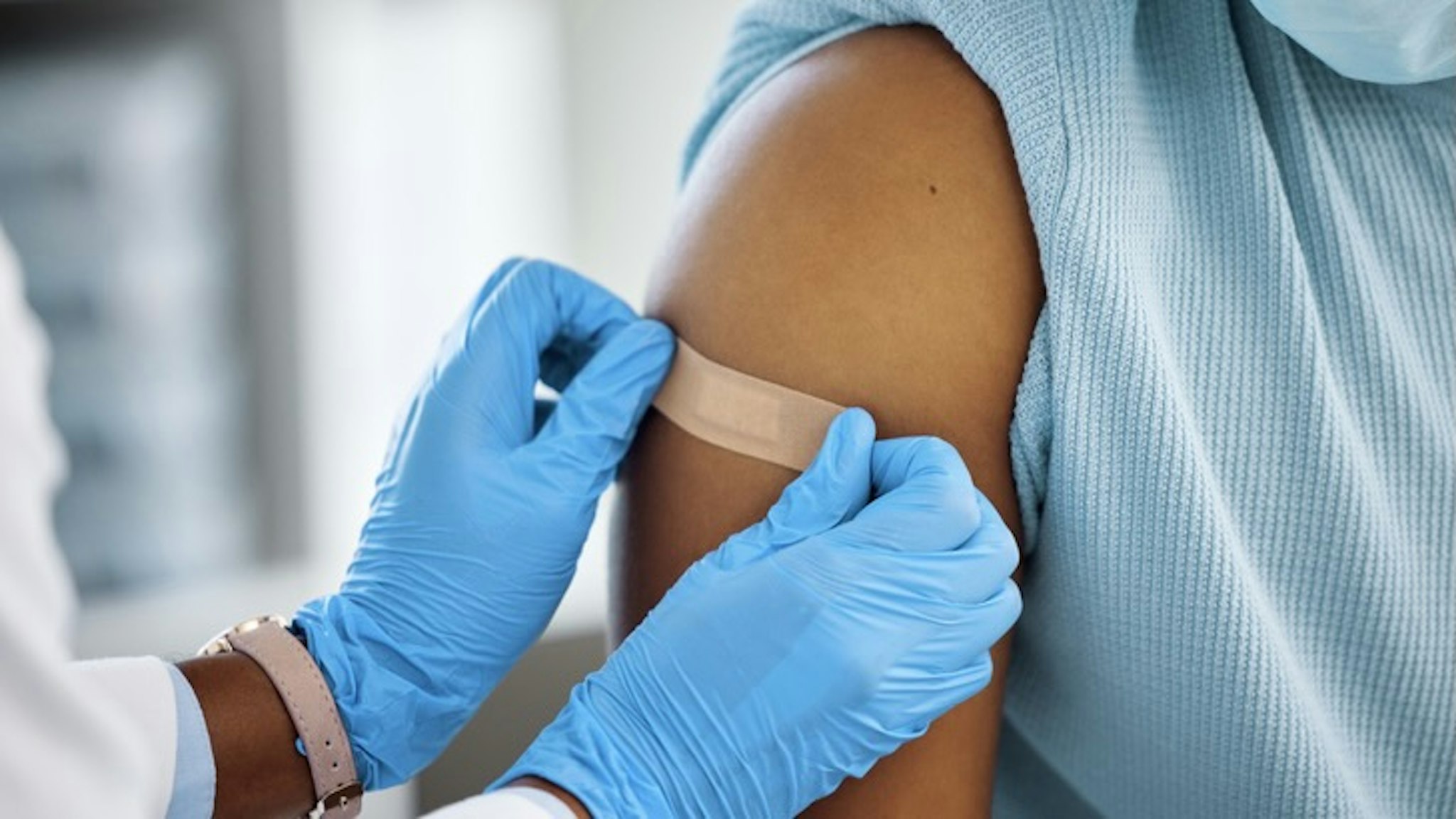 Shot of a doctor applying a plaster to her patients arm - stock photo Just leave this on for an hour PeopleImages via Getty Images