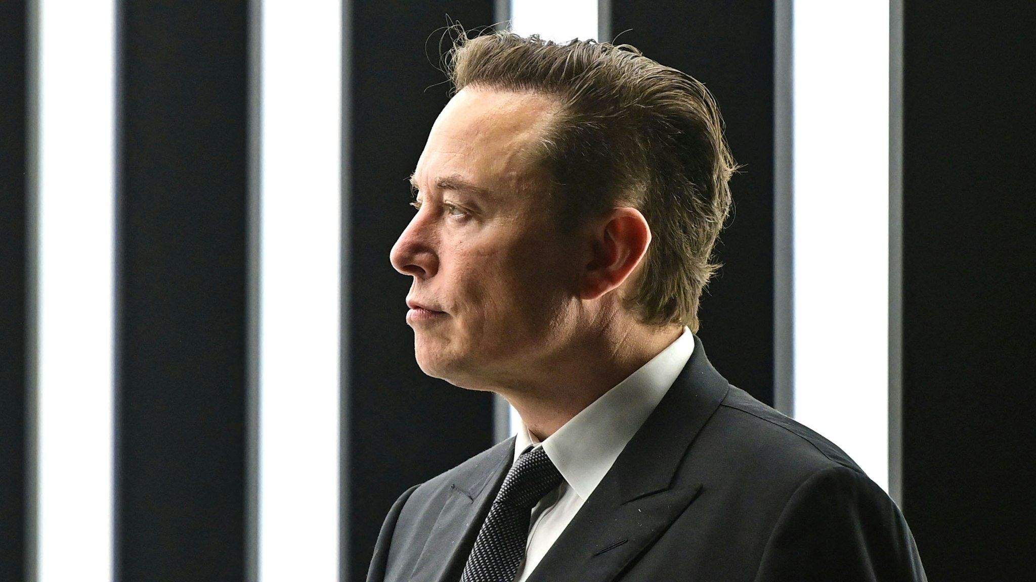 Tesla CEO Elon Musk is pictured as he attends the start of the production at Tesla's "Gigafactory" on March 22, 2022 in Gruenheide, southeast of Berlin. - US electric car pioneer Tesla received the go-ahead for its "gigafactory" in Germany on March 4, 2022, paving the way for production to begin shortly after an approval process dogged by delays and setbacks.