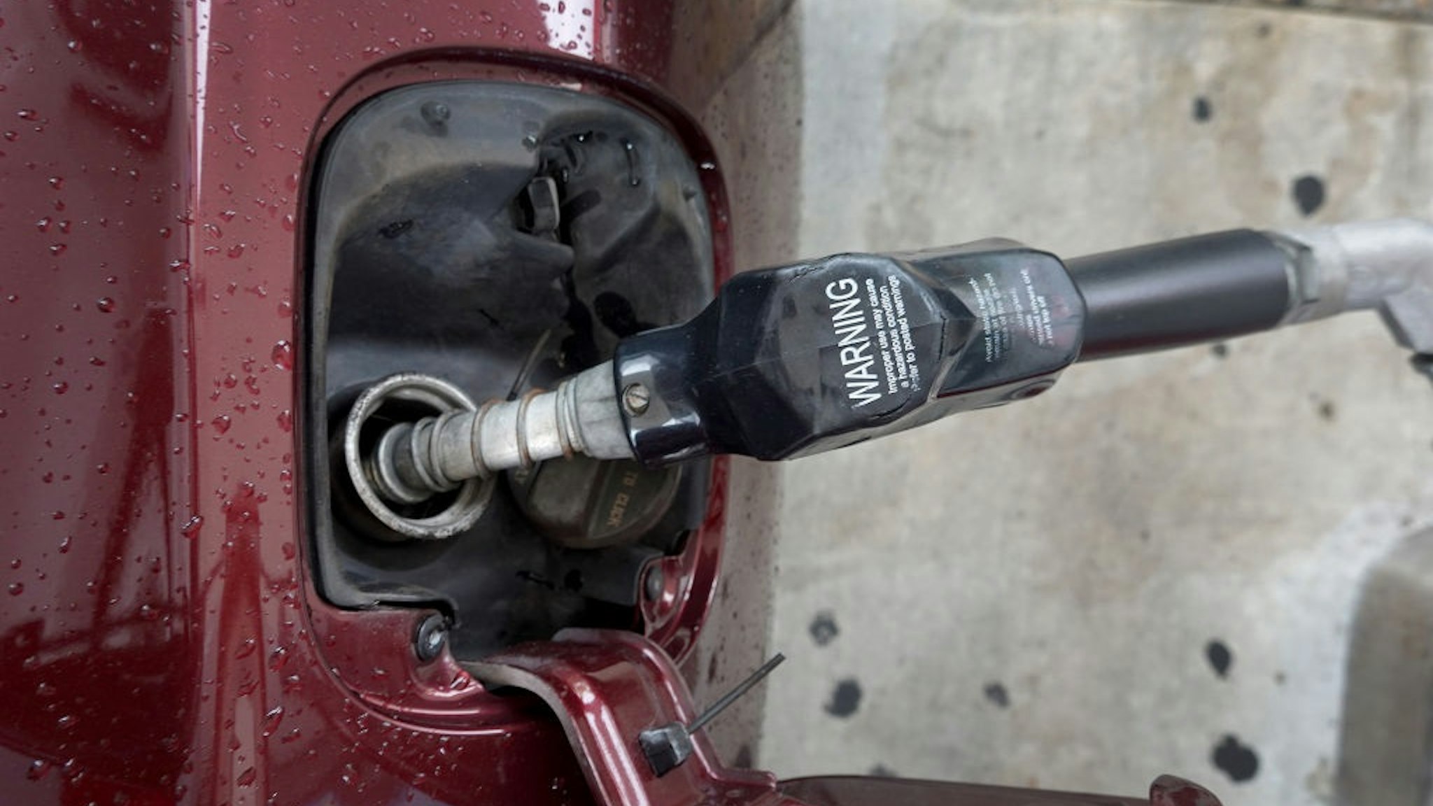MIAMI, FLORIDA - MARCH 10: A customer fuels a vehicle at a gas stationon March 10, 2022 in Miami, Florida.