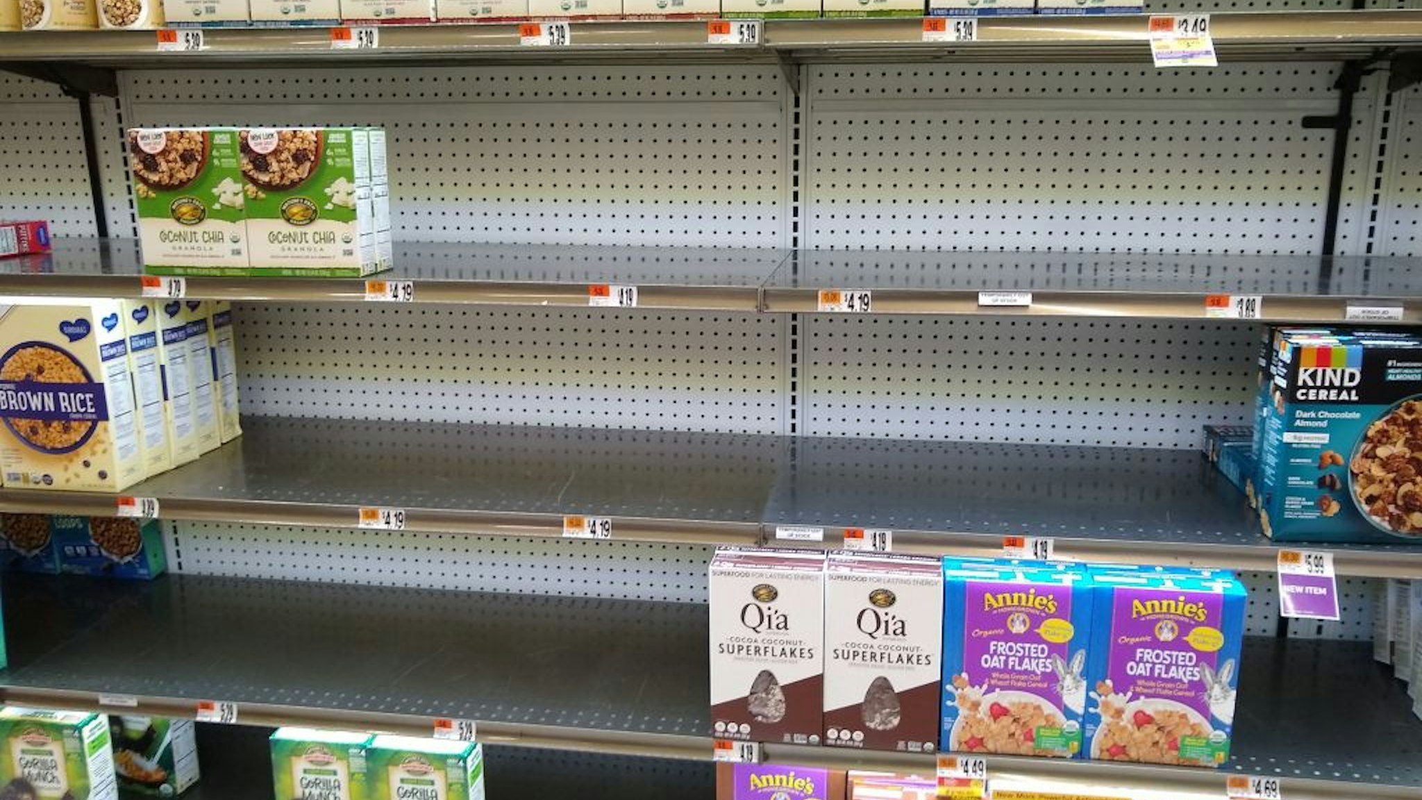 Shelves at a supermarket are nearly empty on January 13, 2022, in Bethesda, Maryland.