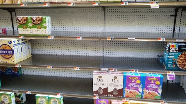 Shelves at a supermarket are nearly empty on January 13, 2022, in Bethesda, Maryland.