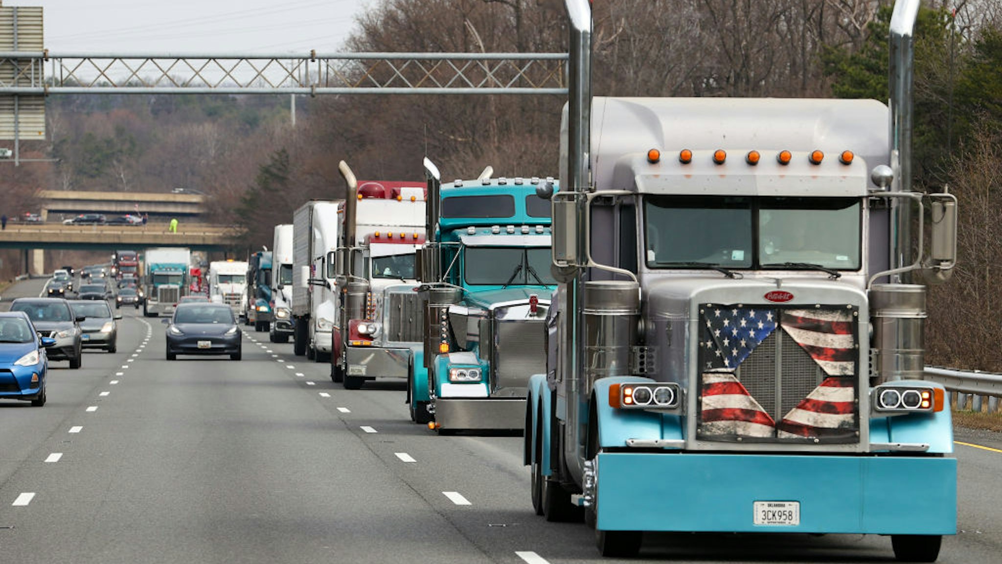 WASHINGTON D.C., USA - MARCH 6: 'The People's Convoy' circle the Beltway in Washington D.C., United States on March 6, 2022. The truckers leading the convoy are demanding an end to the vaccination mandates and full reopening of the country. (Photo by