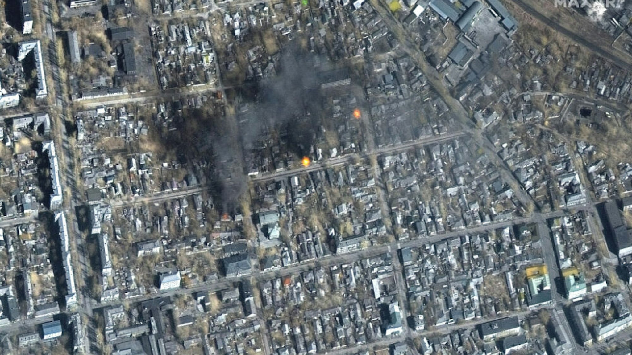 RUSSIANS INVADE UKRAINE -- MARCH 14, 2022: 04 Maxar color infrared satellite view of fires burning near Fontanna Street in eastern Mariupol, Ukraine. 14march2022_wv2.