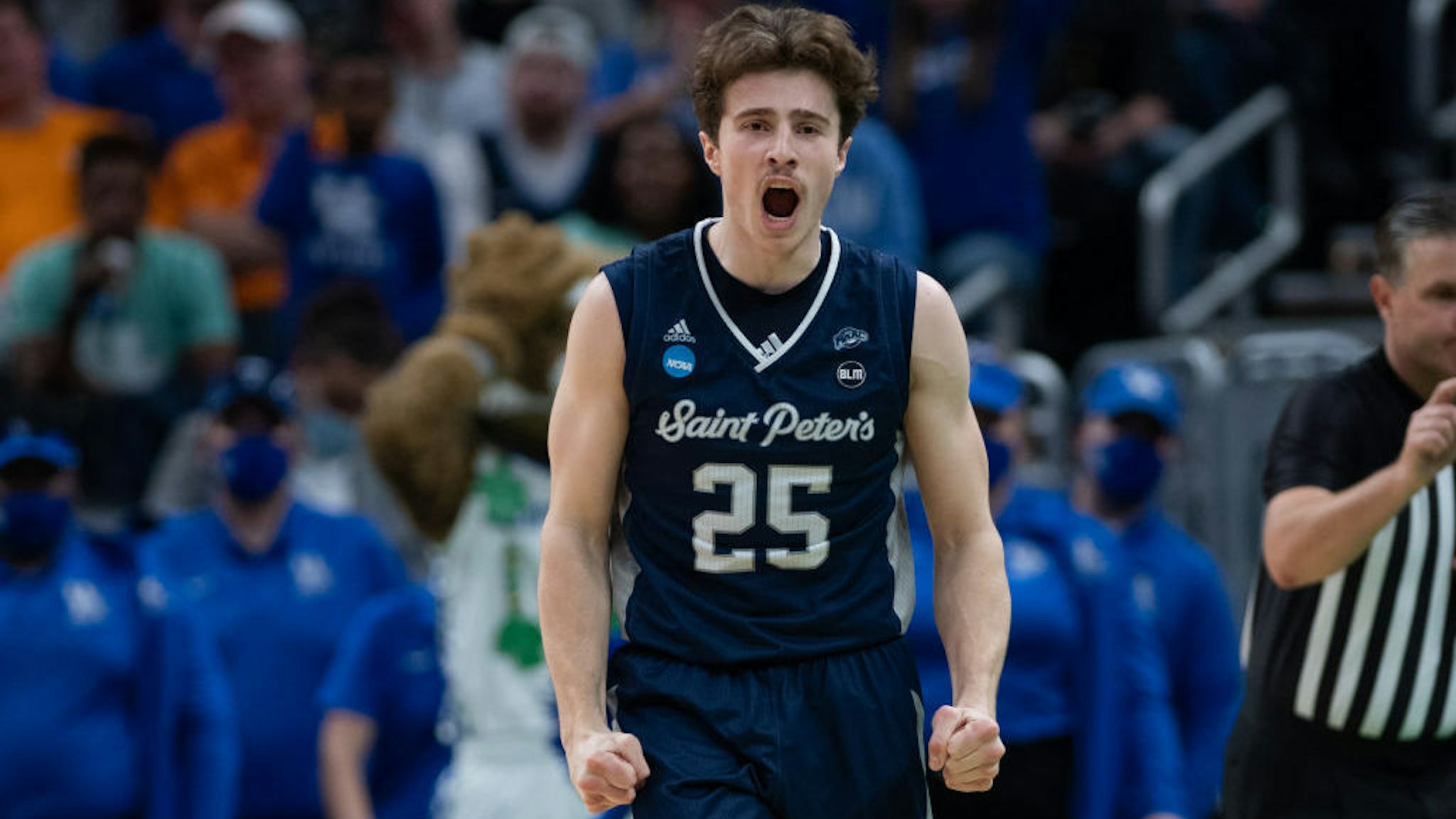INDIANAPOLIS, IN - MARCH 17: Saint Peter's Peacocks guard Doug Edert (25) celebrates after a turnover during the mens March Madness college basketball game between the Kentucky Wildcats and Saint Peters Peacocks on March 17, 2022, at Gainbridge Fieldhouse in Indianapolis, IN. (Photo by Zach Bolinger/Icon Sportswire via Getty Images)