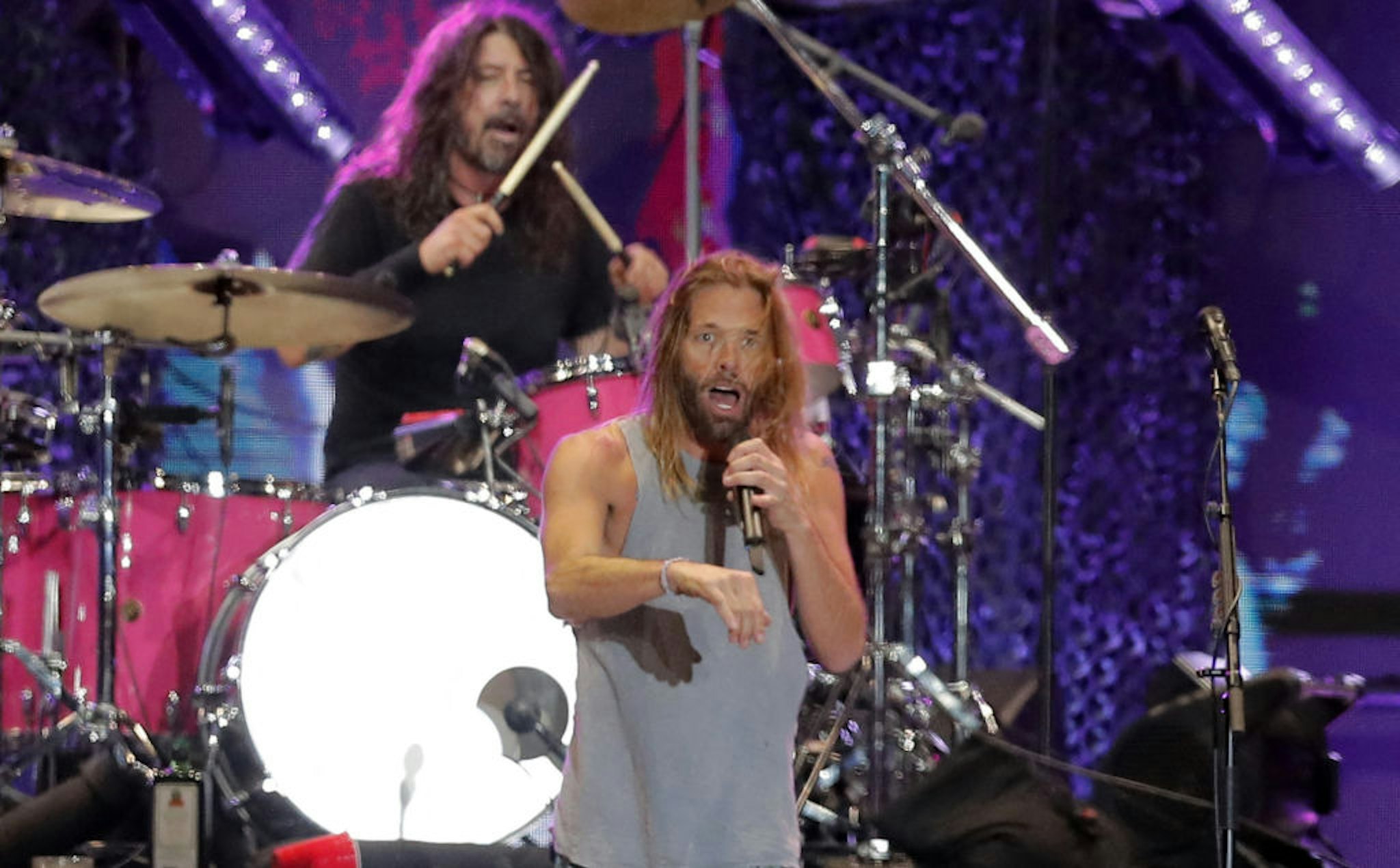 Picture taken on March 18, 2022 of Foo Fighters' drummer Taylor Hawkins and lead singer Dave Grohl on stage, at the Lollapalooza 2022 music festival in Santiago.