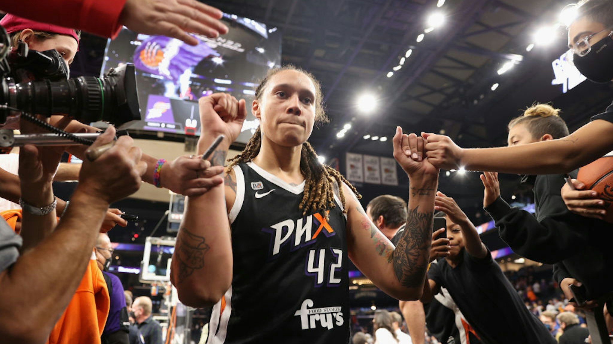 PHOENIX, ARIZONA - OCTOBER 13: Brittney Griner #42 of the Phoenix Mercury celebrates with fans following Game Two of the 2021 WNBA Finals at Footprint Center on October 13, 2021 in Phoenix, Arizona. The Mercury defeated the Sky 91-86 in overtime. NOTE TO USER: User expressly acknowledges and agrees that, by downloading and or using this photograph, User is consenting to the terms and conditions of the Getty Images License Agreement. (Photo by Christian Petersen/Getty Images)