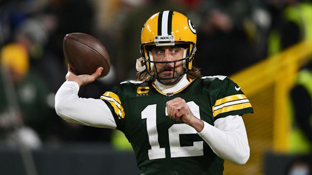 GREEN BAY, WISCONSIN - JANUARY 22: Quarterback Aaron Rodgers #12 of the Green Bay Packers warms up prior to the NFC Divisional Playoff game against the San Francisco 49ers at Lambeau Field on January 22, 2022 in Green Bay, Wisconsin. (Photo by Quinn Harris/Getty Images)