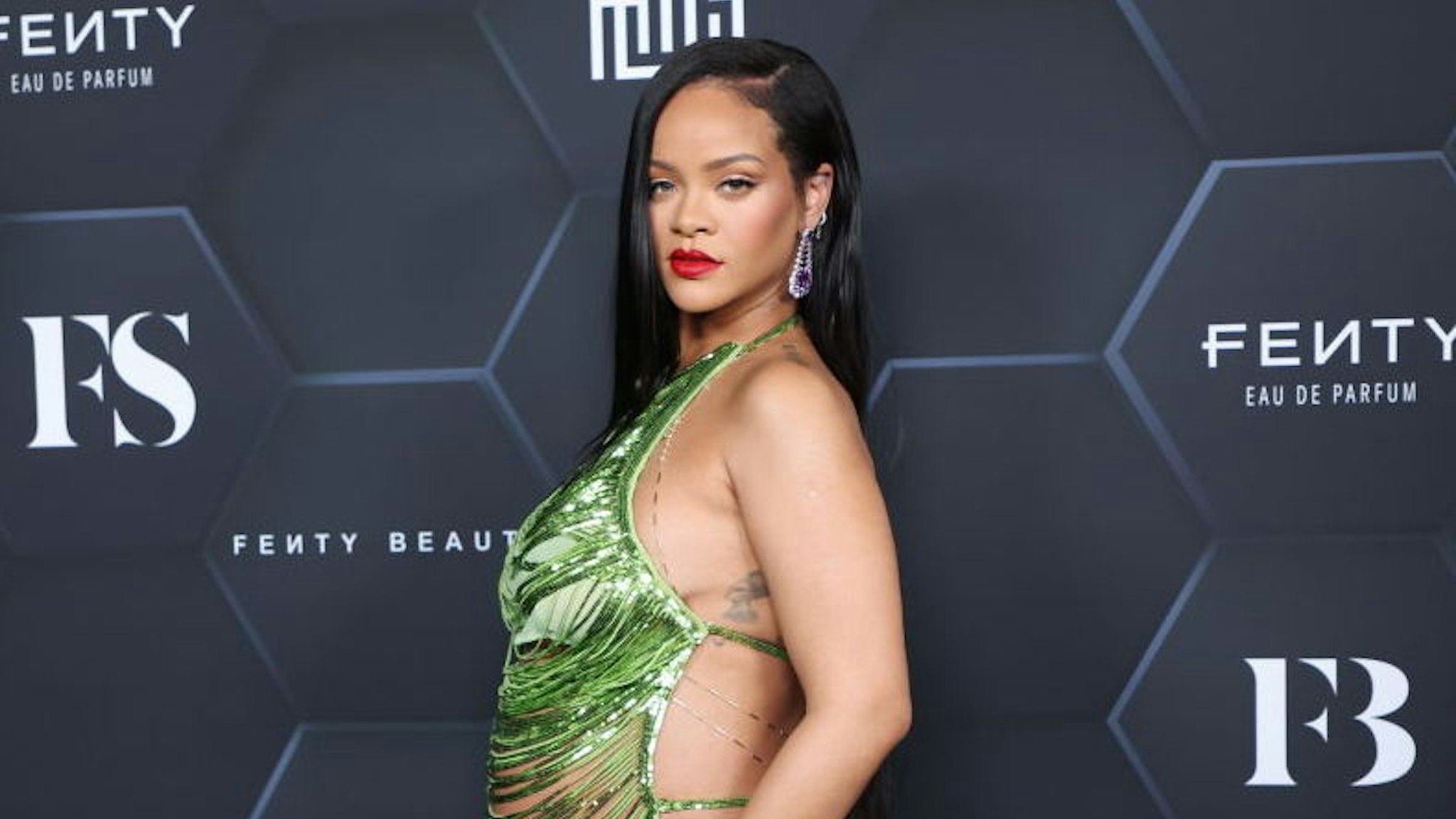 Rihanna poses for a picture as she celebrates her beauty brands fenty beauty and fenty skin at Goya Studios on February 11, 2022 in Los Angeles, California.