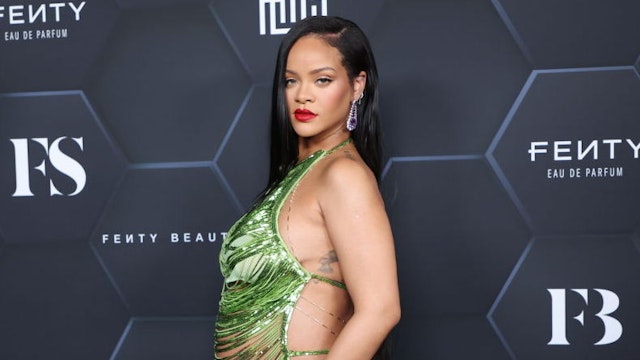 Rihanna poses for a picture as she celebrates her beauty brands fenty beauty and fenty skin at Goya Studios on February 11, 2022 in Los Angeles, California.