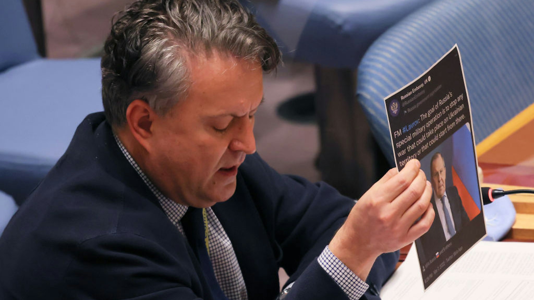 NEW YORK, NEW YORK - MARCH 07: Sergiy Kyslytsya, United Nations permanent representative of Ukraine, holds up a printout of a retweet of Russian Foreign Minister Sergei Lavrov, during a speech to the U.N. Security Council in a meeting to discuss the humanitarian crisis in Ukraine at U.N. headquarters on March 07, 2022 in New York City. The body met as Russia's invasion of Ukraine continues. Yesterday, a mortar shell fired by Russian forces killed a family of four in the city of Irpin as they fled the fighting. Russian President Vladimir Putin has denied that soldiers are targeting civilians fleeing combat zones. (Photo by Michael M. Santiago/Getty Images)