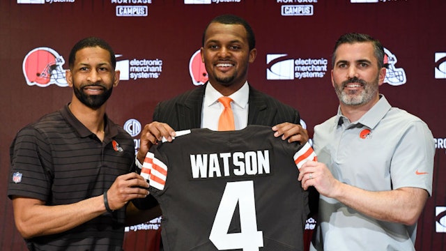 BEREA, OHIO - MARCH 25: Quarterback Deshaun Watson #4 of the Cleveland Browns is introduced by general manager Andrew Berry (L) and head coach Kevin Stefanski during a press conference at CrossCountry Mortgage Campus on March 25, 2022 in Berea, Ohio. (Photo by Nick Cammett/Getty Images)