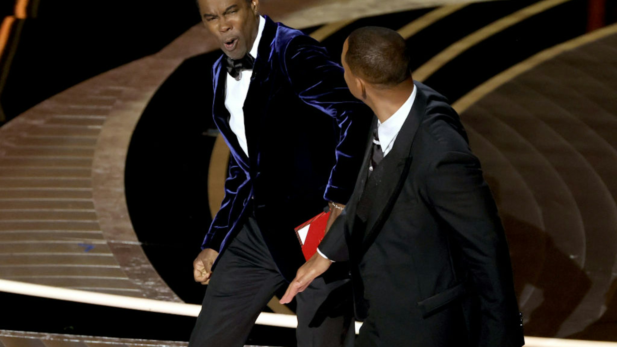 HOLLYWOOD, CALIFORNIA - MARCH 27: Will Smith appears to slap Chris Rock onstage during the 94th Annual Academy Awards at Dolby Theatre on March 27, 2022 in Hollywood, California. (Photo by Neilson Barnard/Getty Images)