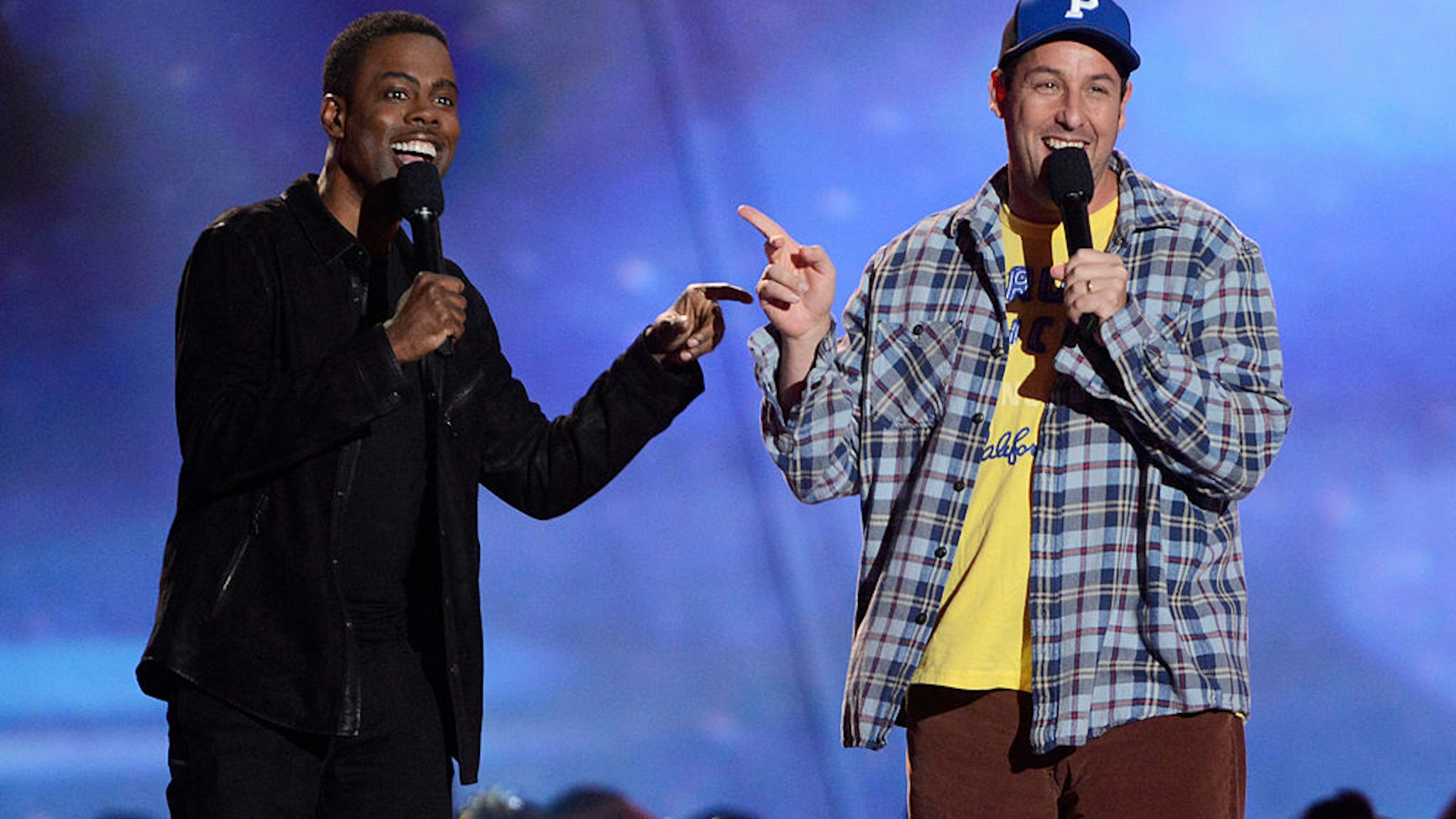 CULVER CITY, CA - APRIL 14: Actors Chris Rock (L) and Adam Sandler speak onstage during the 2013 MTV Movie Awards at Sony Pictures Studios on April 14, 2013 in Culver City, California. (Photo by Kevin Mazur/WireImage)
