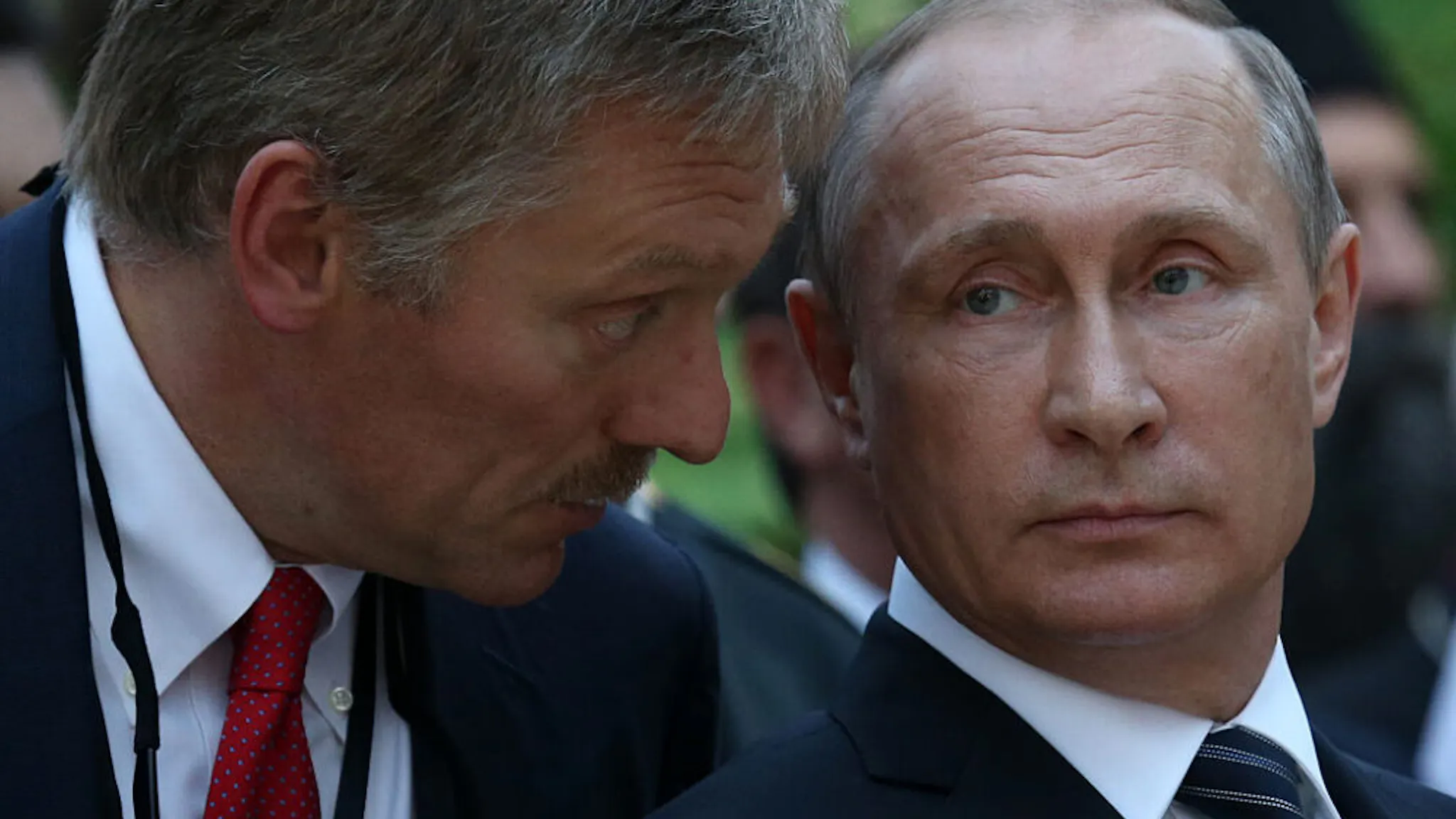 Putin and Peskov BRDO PRI KRAJU, SLOVENIA - JULY 30: (RUSSIA OUT) Russian President Vladimir Putin (R) listens to his press secretary Dmitry Peskov during a visit the Russian Church marking its 100-th jubelee today in Brdo pri Kraju, Slovenia, July, 30, 2016. Vladimir Putin is having a one-day trip Slovenia.