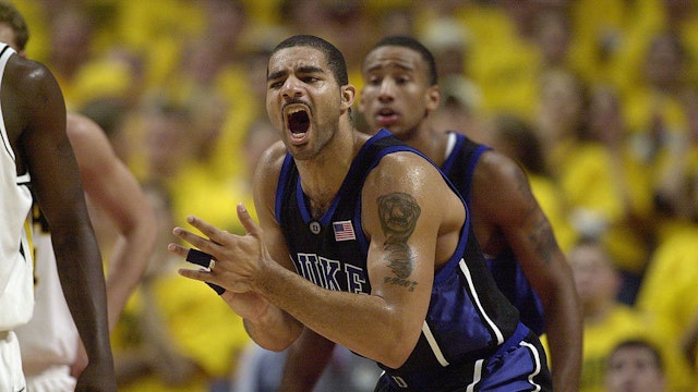 CHICAGO - NOVEMBER 27: Carlos Boozer #4 of the Duke Blue Devils celebrates during the ACC/Big Ten Challenge against the Iowa Hawkeyes at United Center in Chicago, Illinois on November 27, 2001. The Blue Devils won 80-62. (Photo by Jonathan Daniel/Getty Images)