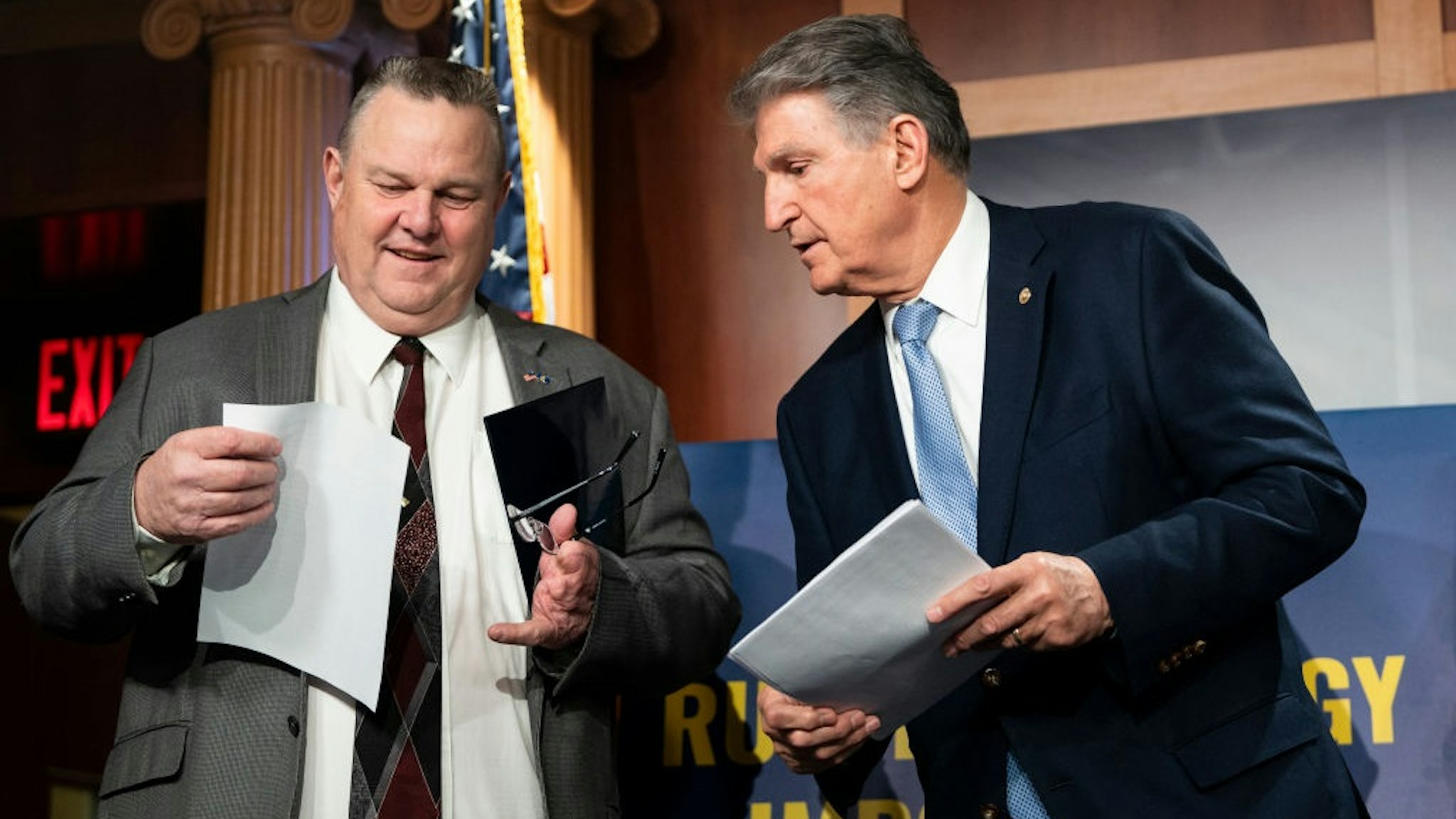 UNITED STATES - MARCH 3: Sen. Jon Tester, D-Mont., left, and Sen. Joe Manchin, D-W. Va., talk beofre the start of the Ban Russian Energy Imports Act news conference in the Capitol on Thursday, March 3, 2022.