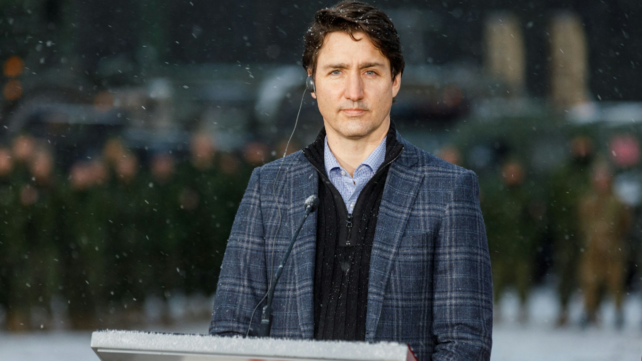Canada's Prime Minister Justin Trudeau addresses a press conference at the end of a visit of the Adazi military base, north east of Riga, Latvia, on March 8, 2022.