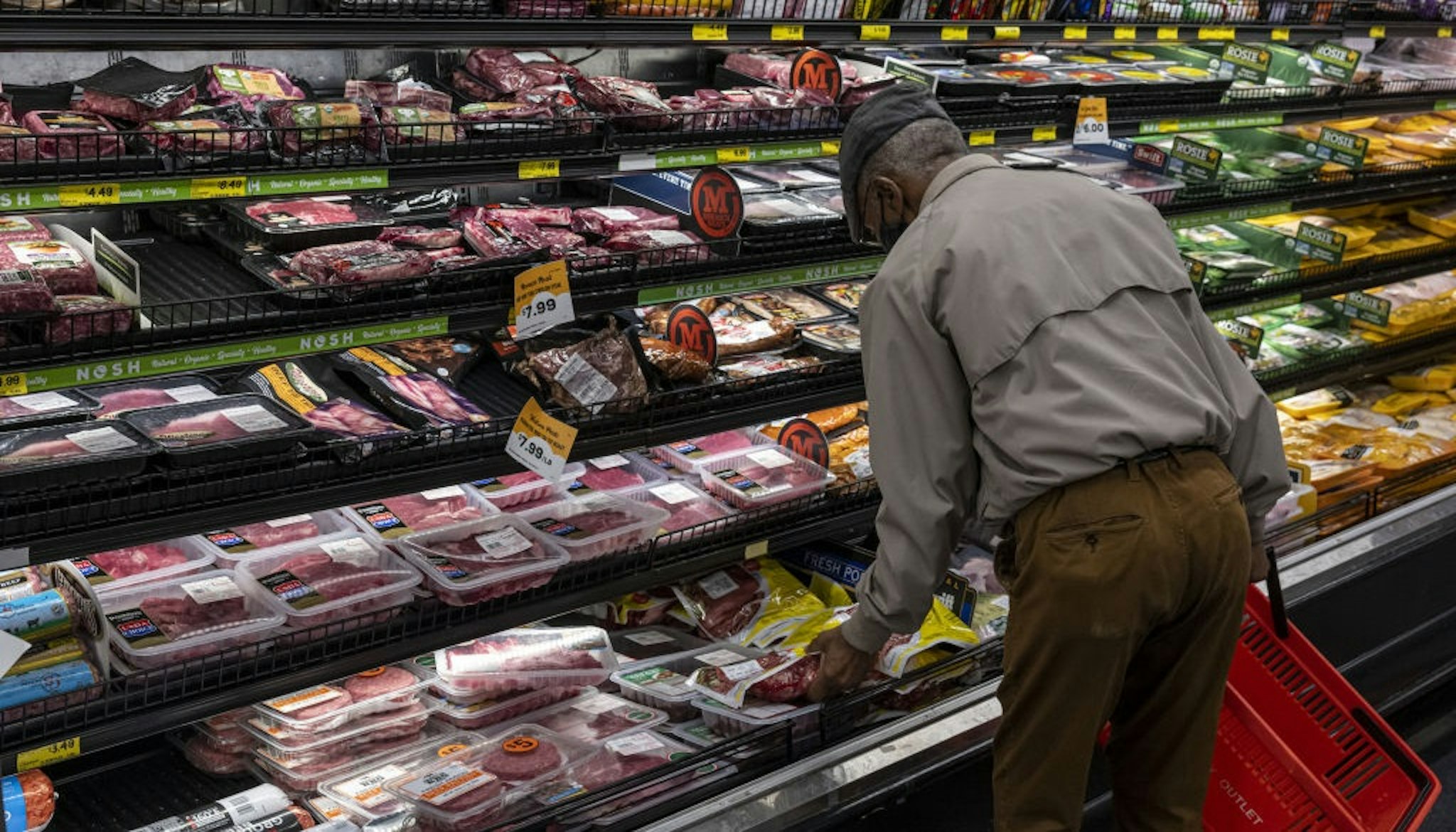A customer shops in the meat aisle of a store in San Francisco, California, U.S., on Thursday, Nov. 11, 2021.