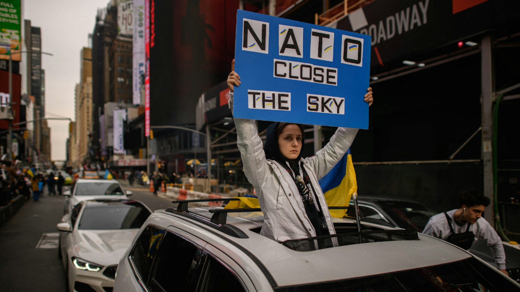 Members and supporters of the Ukrainian community attend a protest against the Russian invasion and call for a no-fly zone, in Times Square, New York, on March 5, 2022.
