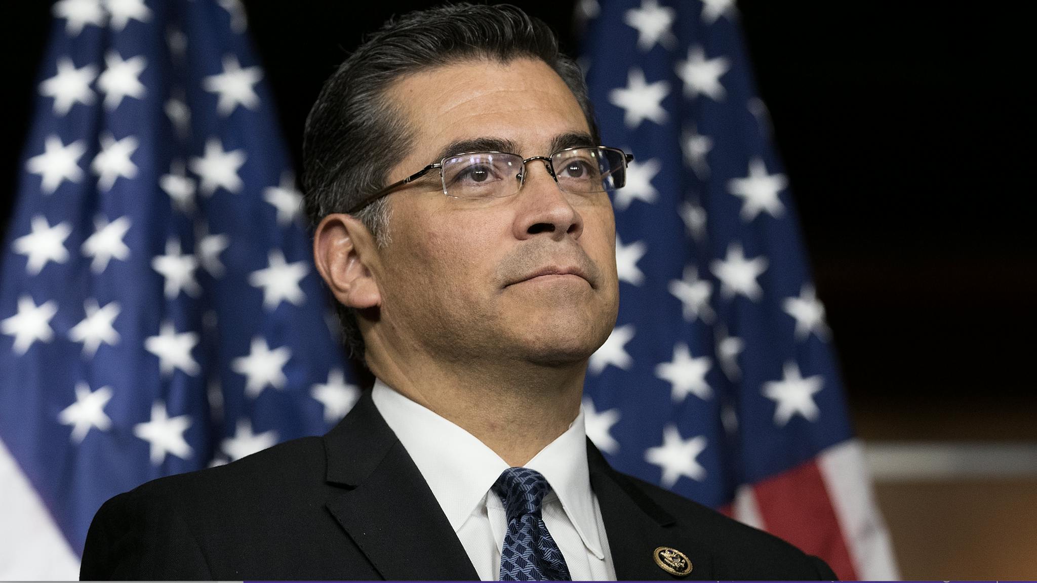 Screen Shot 2022-03-02 at 8.52.22 PM Rep. Xavier Becerra (D-CA) listens during a news conference to discuss the rhetoric of presidential candidate Donald Trump, at the U.S. Capitol, May 11, 2016, in Washington, DC.