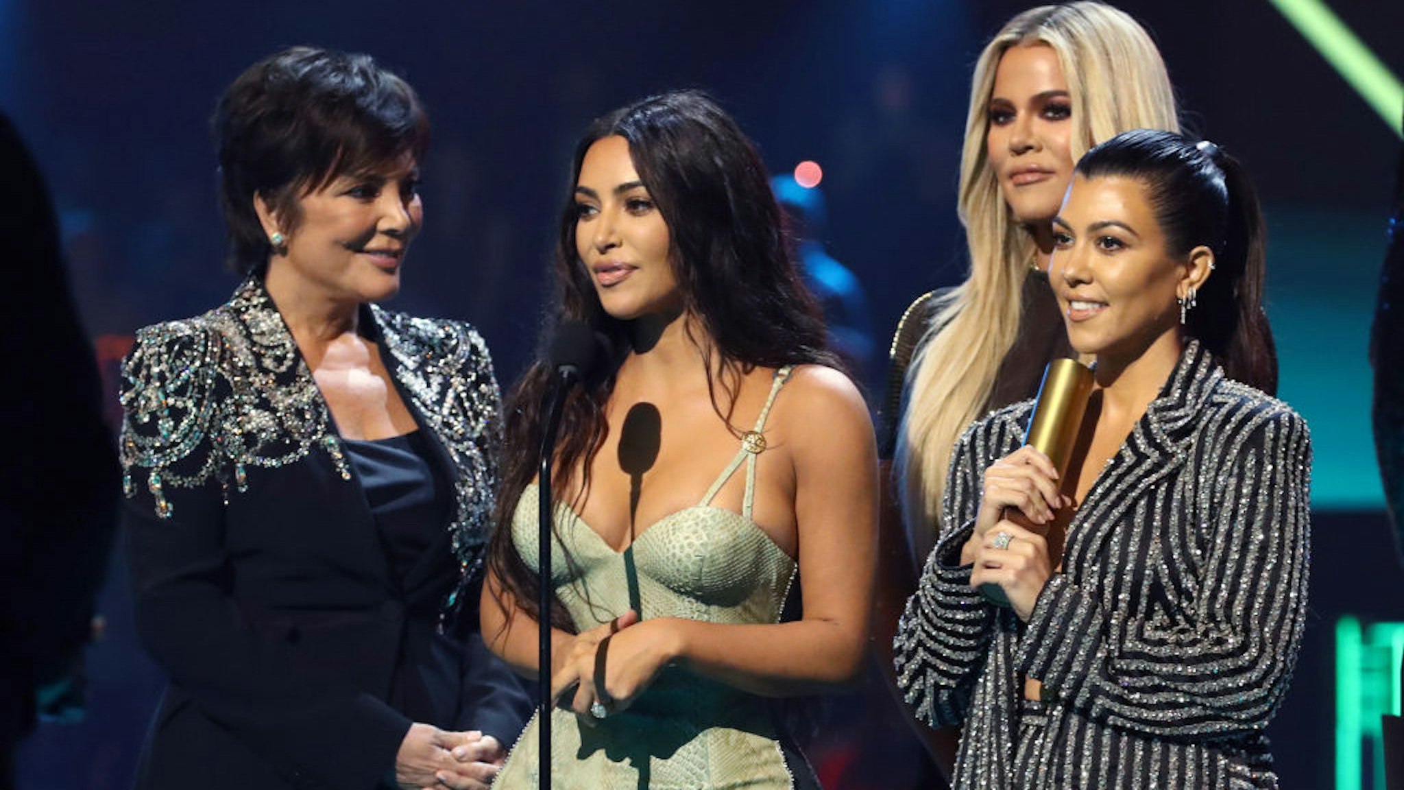 Kris Jenner, Kim Kardashian, Khloé Kardashian, and Kourtney Kardashian accept The Reality Show of 2019 for 'Keeping Up with the Kardashians' on stage during the 2019 E! People's Choice Awards held at the Barker Hangar on November 10, 2019.