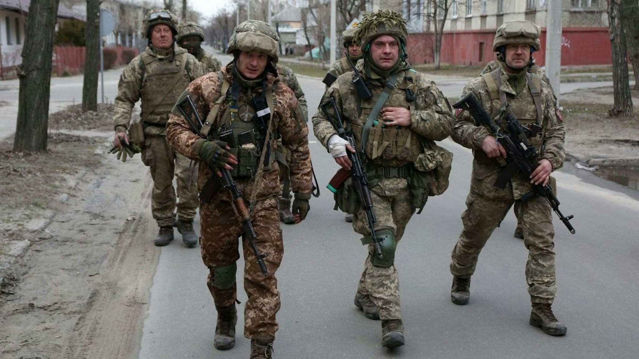 Servicemen of Ukrainian Military Forces walk in the small town of Sievierodonetsk, Lugansk Oblast, on February 27, 2022.