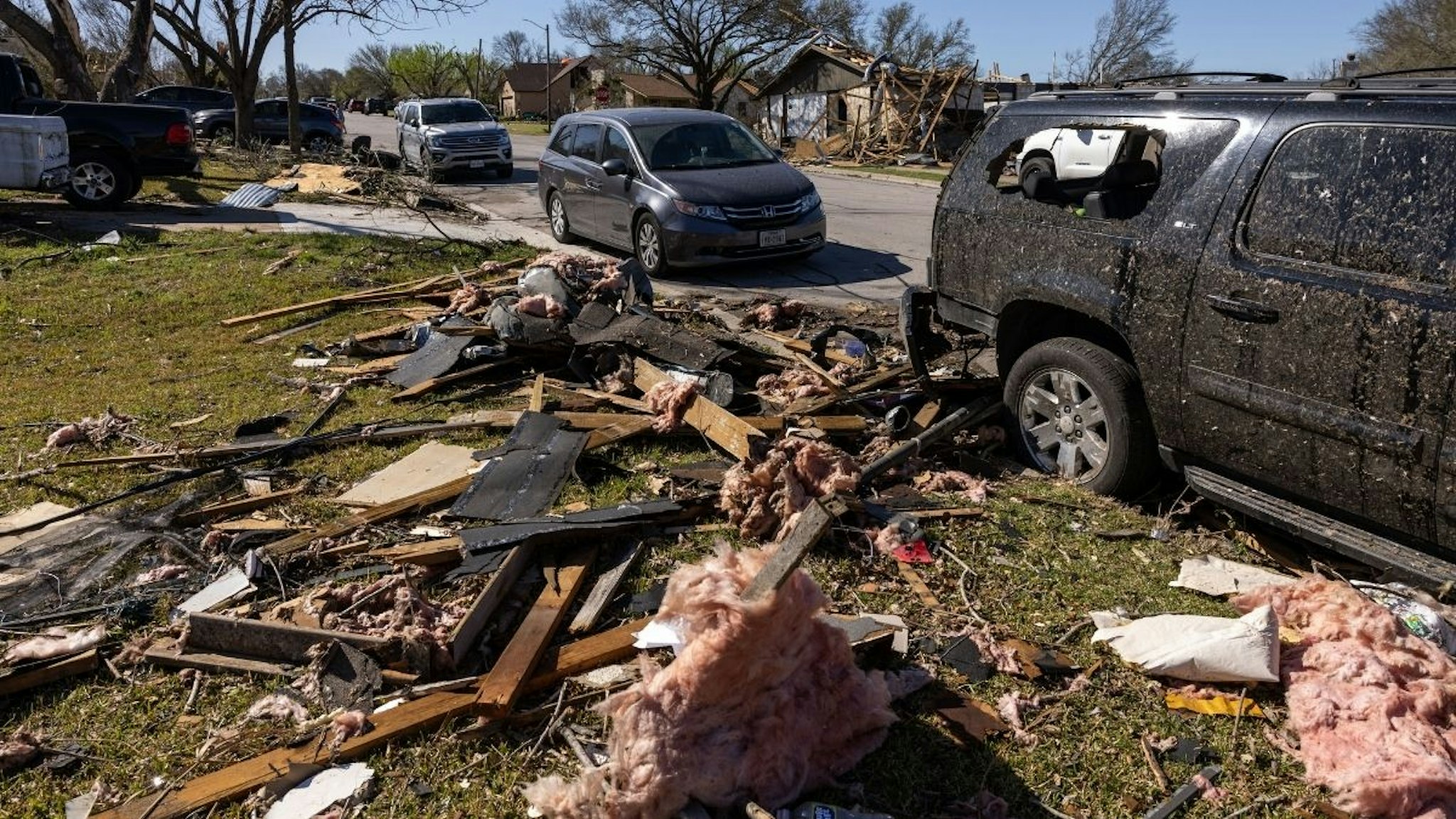 Debris in the front yard of a damaged home following a tornado in Round Rock, Texas, U.S., on Tuesday, March 22, 2022.