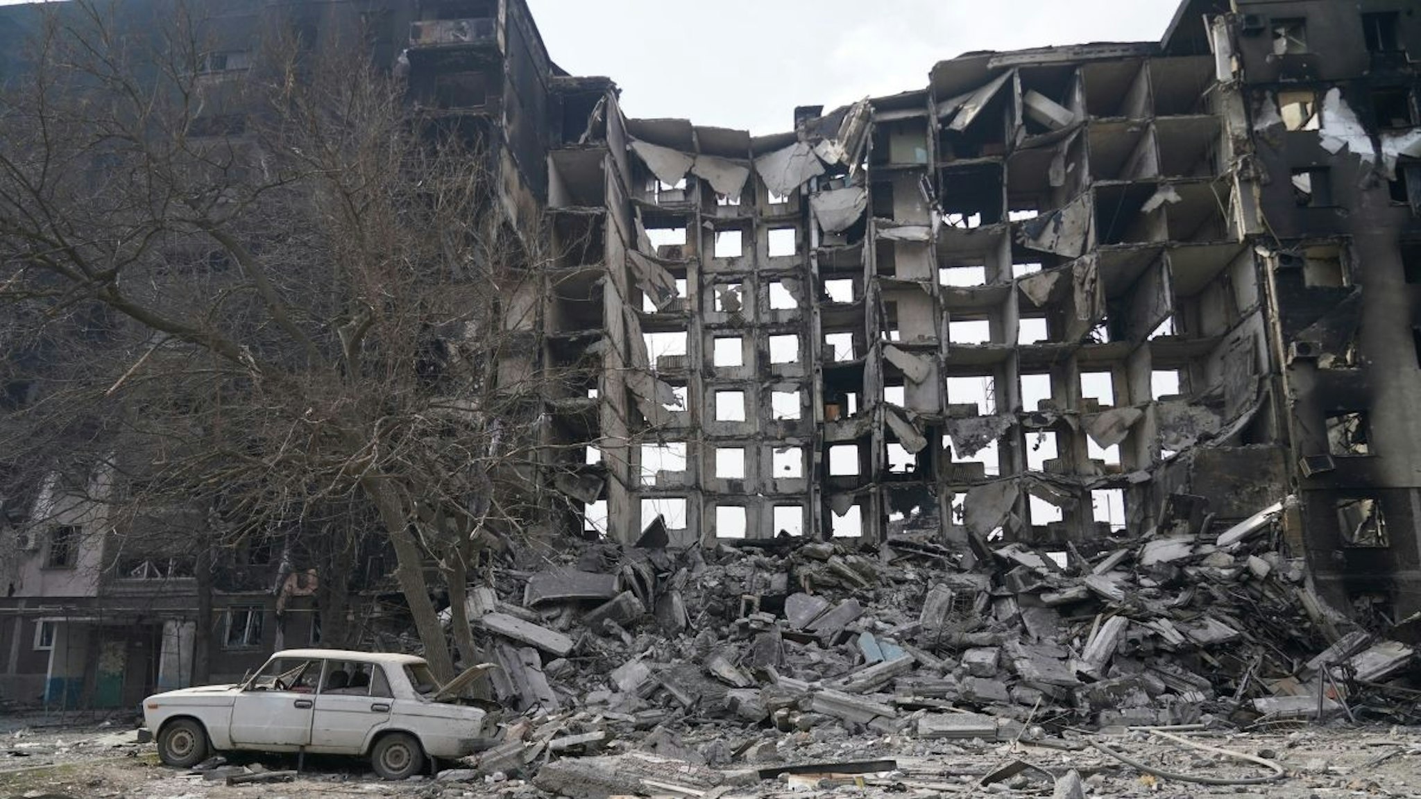 Collapsed building is seen as civilians are being evacuated along humanitarian corridors from the Ukrainian city of Mariupol under the control of Russian military and pro-Russian separatists, on March 26, 2022.