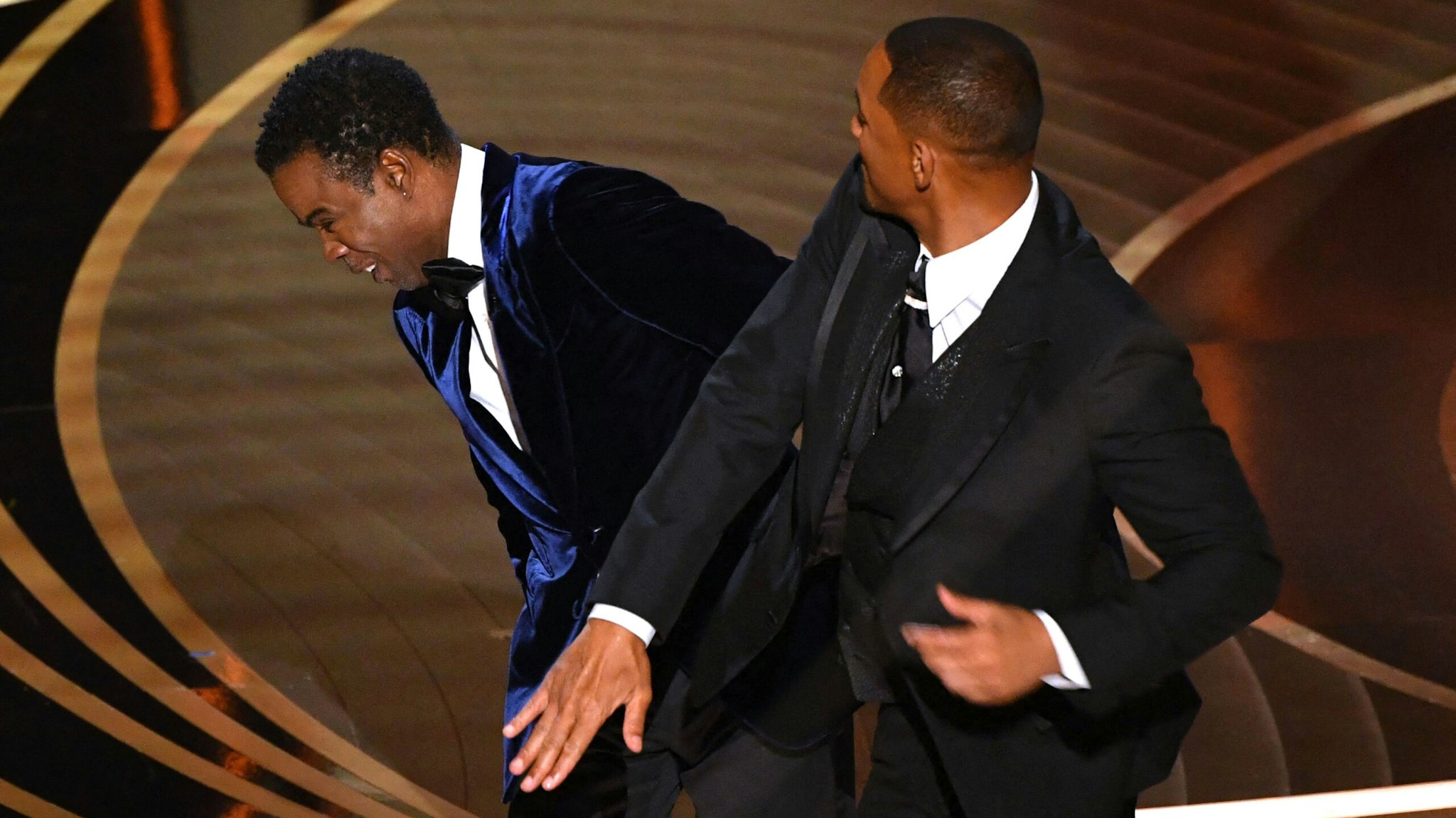 US actor Will Smith (R) slaps US actor Chris Rock onstage during the 94th Oscars at the Dolby Theatre in Hollywood, California on March 27, 2022.