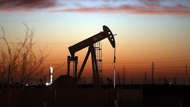 ANDREWS, TX - JANUARY 20: An oil pumpjack works at dawn in the Permian Basin oil field on January 20, 2016 in the oil town of Andrews, Texas. Despite recent drops in the price of oil, many residents of Andrews, and similar towns across the Permian, are trying to take the long view and stay optimistic. The Dow Jones industrial average plunged 540 points on Wednesday after crude oil plummeted another 7% and crashed below $27 a barrel. (Photo by