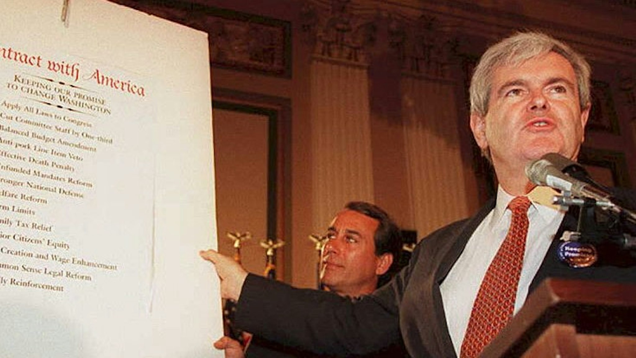 WASHINGTON, DC - FEBRUARY 22: Speaker of the US House of Representatives Newt Gingrich(R-GA), holds up a copy of the Republican party's "Contract With America" during a rally to celebrate the first 50 days of the Republican majority in Congress 22 February. Gigngrich is also preparing a plan to outline the House agenda for the rest of the year, which will attempt to put substance behind the Republican call for a balanced budget.