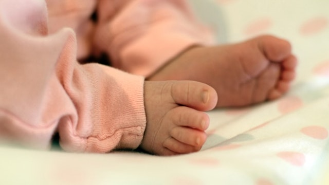 Newborn Feet - stock photo Newborn Feet on changing table Mitch Diamond via Getty Images