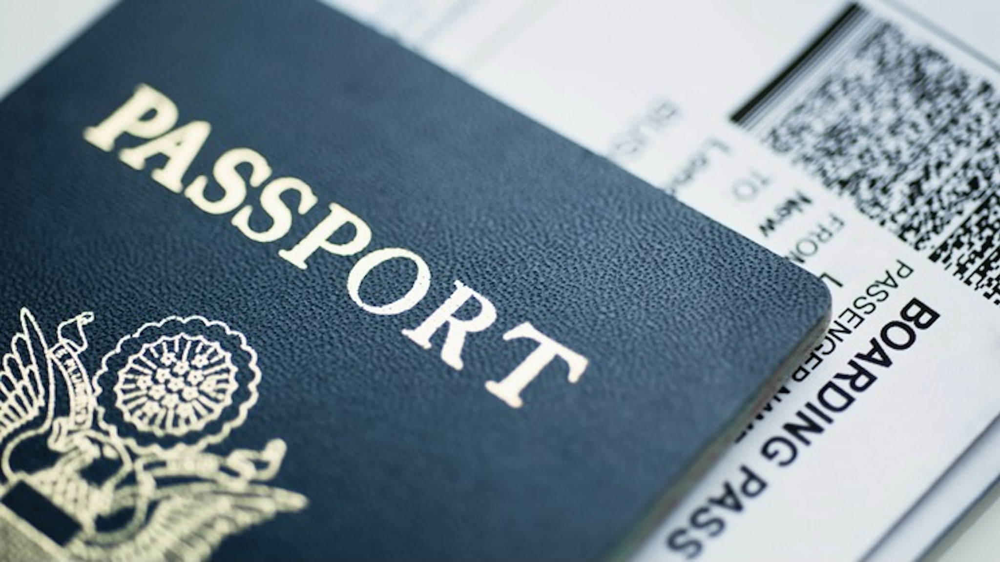 American passport with boarding pass inside - stock photo Tetra Images via Getty Images