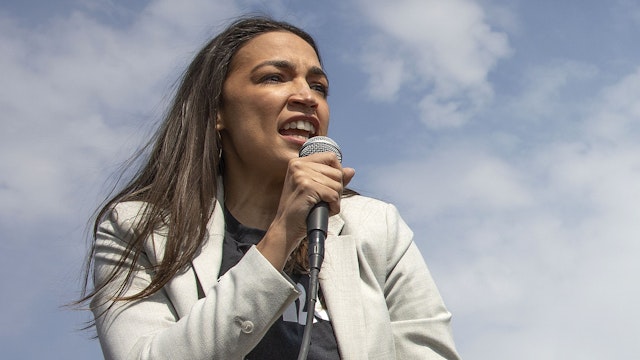 STATEN ISLAND, NEW YORK - APRIL 24: At a union rally on the eve of a vote to unionize a second Amazon faculty on Staten Island, fired Amazon employee and union organizer Chris Smalls is joined by Alexandria Ocasio-Cortez and Bernie Sanders on April 24, 2024 outside of the LDJ5 Sort Center in Staten Island, New York.