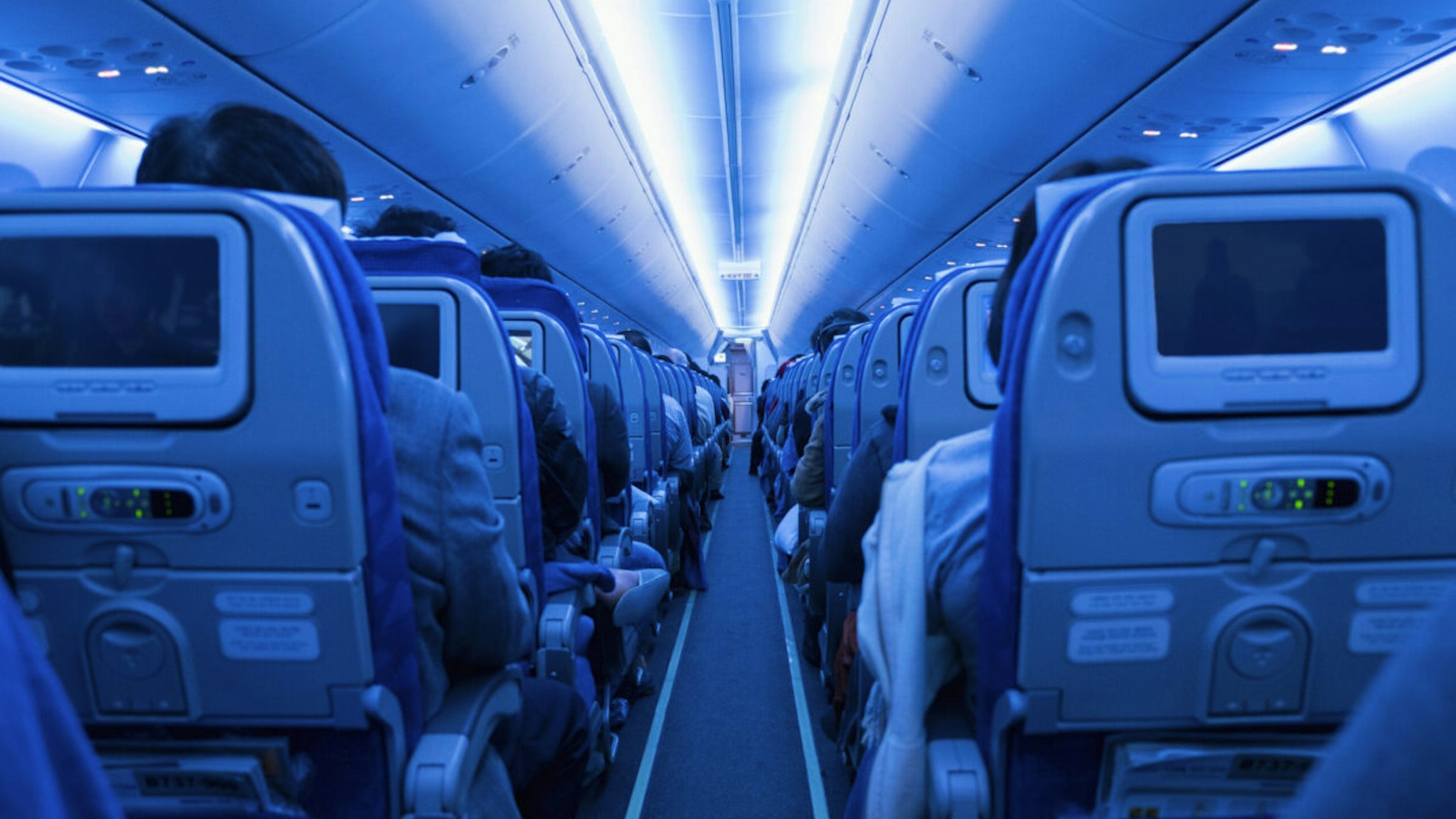 Aisle in full airplane