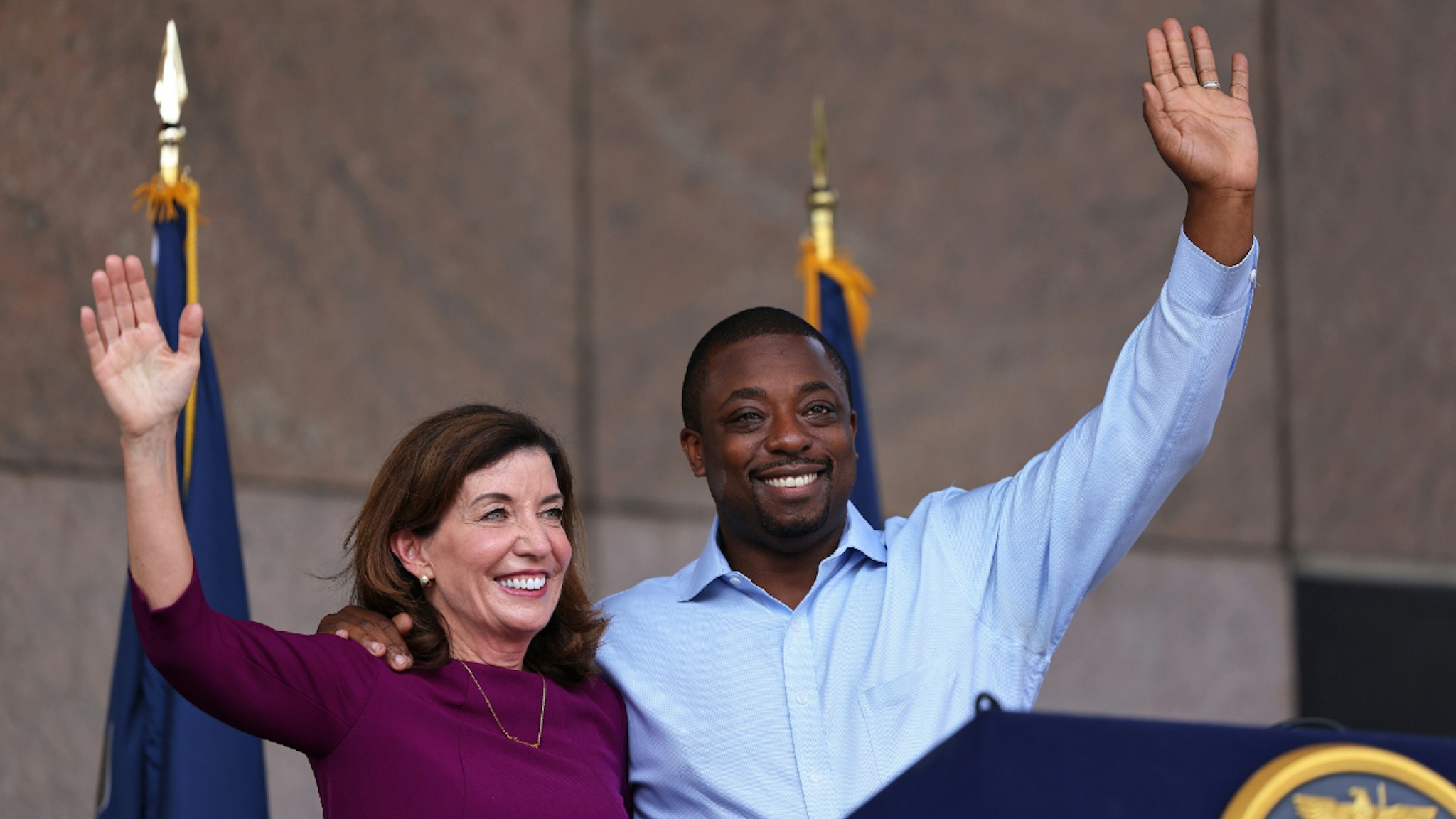 NEW YORK, NEW YORK - AUGUST 26: New York Gov. Kathy Hochul and State Senator Brian Benjamin wave at the crowd during a press conference announcing him as her Lt. Governor on August 26, 2021 in New York City. Senator Benjamin, who placed fourth in the Democratic primary for city comptroller earlier this year, will replace Hochul who was sworn in as Governor this week after the resignation of former Gov. Andrew Cuomo. Senator Benjamin has been a lead sponsor and advocate for criminal and police reforms that includes the Eric Garner Anti-Chokehold Act and the Less is More Act, which restricts the use of incarceration for non-criminal technical parole violations. He has also been a proponent of affordable housing.