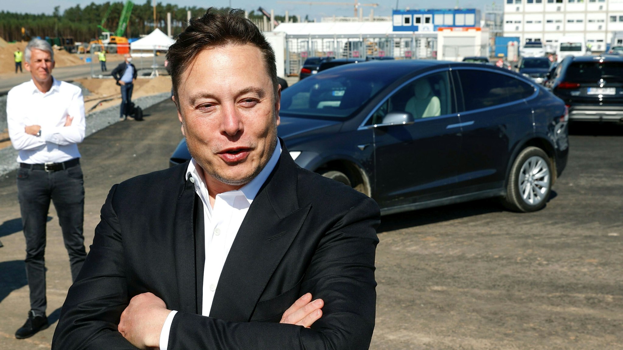 Tesla CEO Elon Musk talks to media as he arrives to visit the construction site of the future US electric car giant Tesla, on September 03, 2020 in Gruenheide near Berlin. - Tesla builds a compound at the site in Gruenheide in Brandenburg for its first European "Gigafactory" near Berlin.