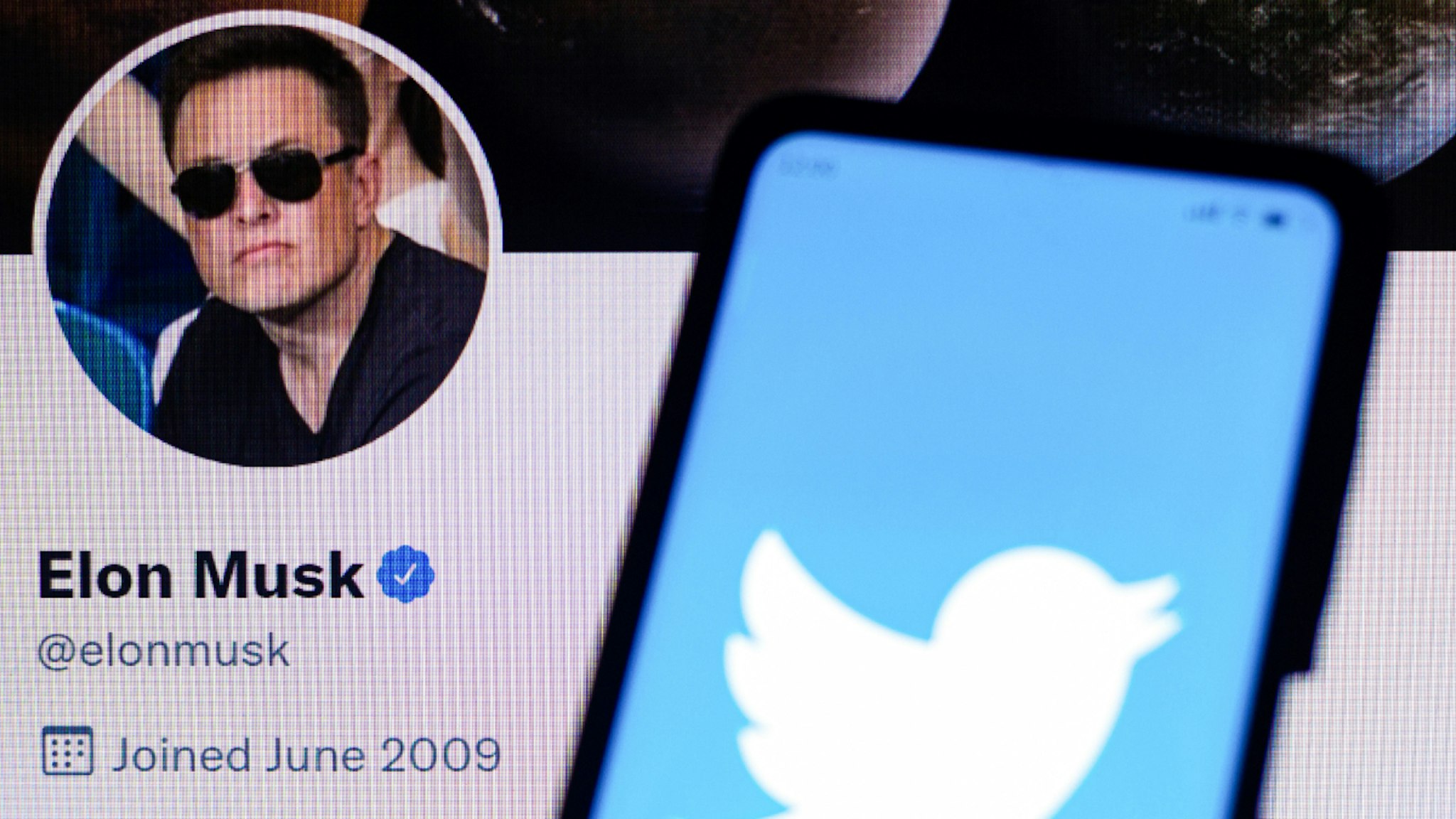 BRAZIL - 2022/04/11: In this photo illustration, the Twitter logo is displayed on a smartphone with Elon Musk's official Twitter profile. The billionaire Elon Musk bought 9% of Twitter, an investment of USD 3 billion.
