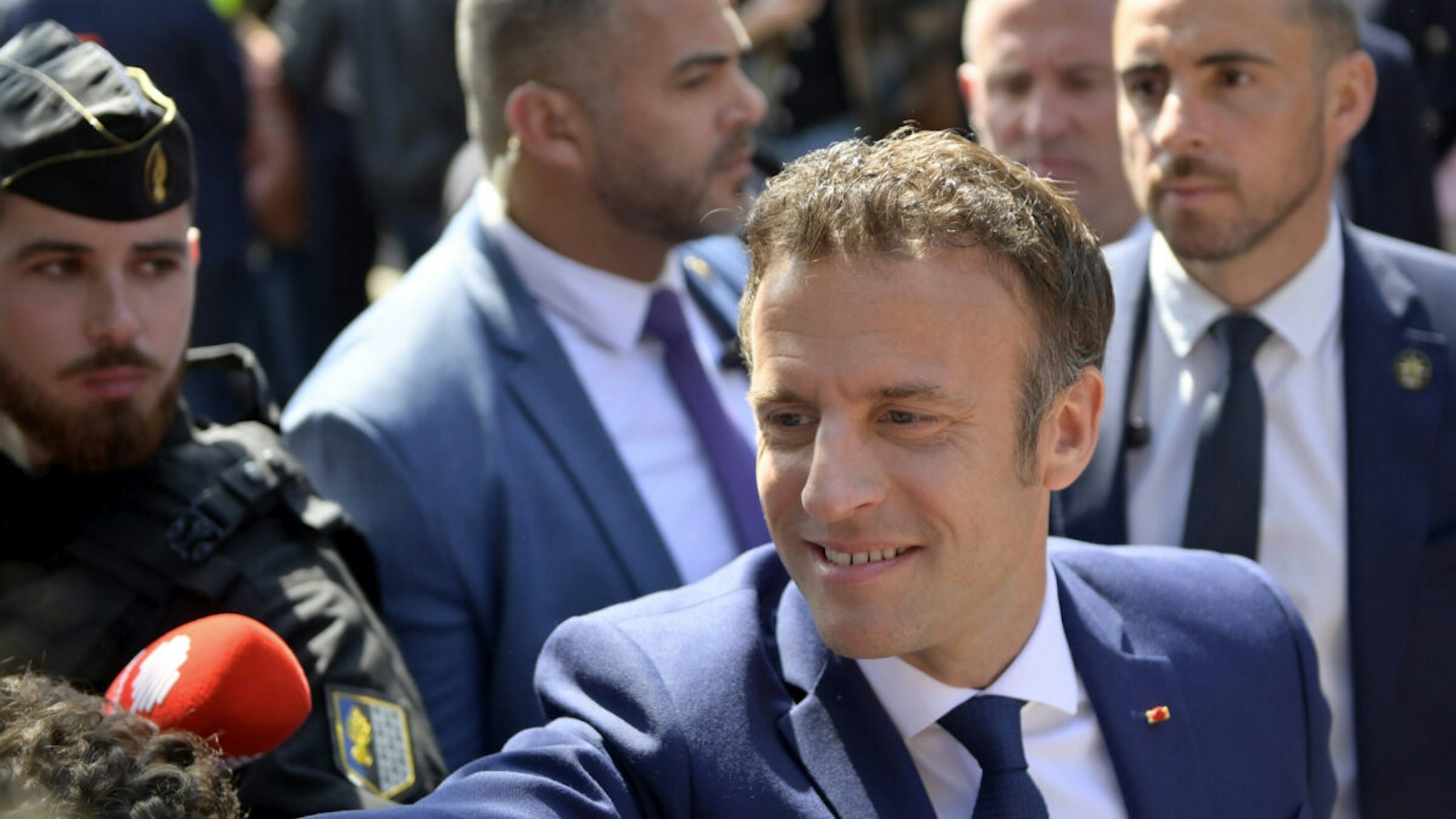 Emmanuel Macron salutes voters as he leaves his house to go vote on April 24, 2022 in Le Touquet-Paris-Plage, France. Emmanuel Macron and Marine Le Pen were both qualified on Sunday April 10th for France's 2022 presidential election second round to be held on April 24
