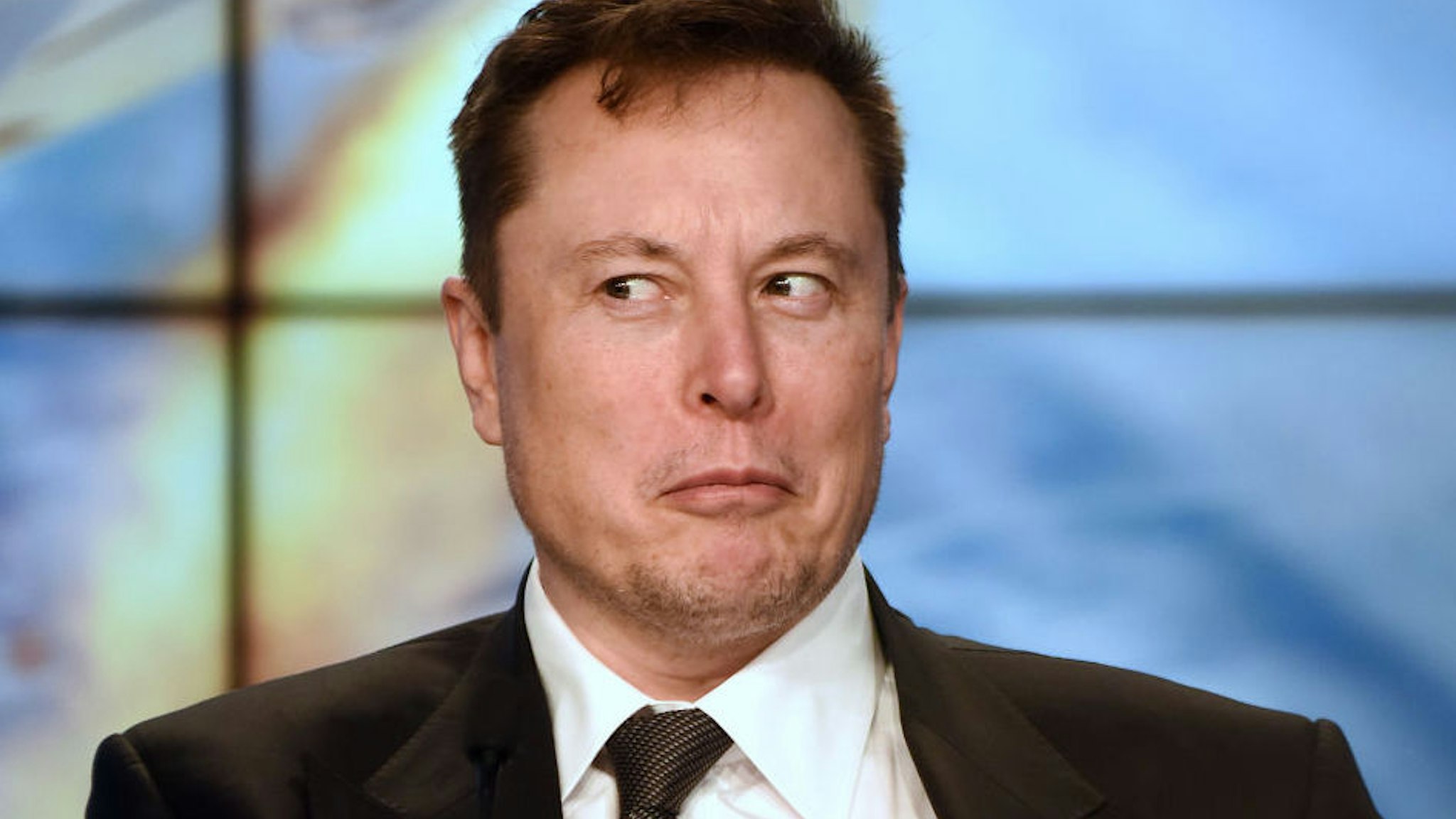Kennedy Space Center, Florida, United States - SpaceX CEO Elon Musk reacts to a question from the media at a press conference following the successful In-Flight Abort Test of the SpaceX Falcon 9 rocket and Crew Dragon capsule on January 19, 2020 at the Kennedy Space Center in Florida.