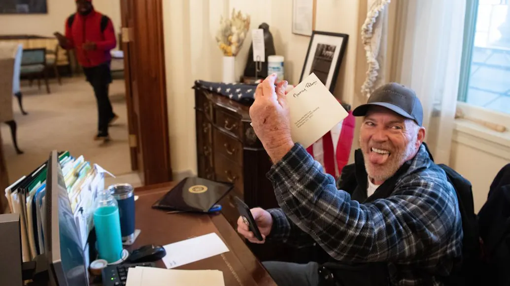 Protester Who Kicked It At Pelosi’s Desk Was ‘Pushed Into The Capitol,’ Lawyer Says