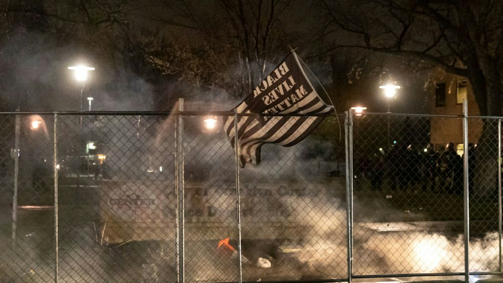 A Black Lives Matter flag is seen after curfew as demonstrators protest the death of Daunte Wright who was shot and killed by a police officer in Brooklyn Center, Minnesota on April 12, 2021.