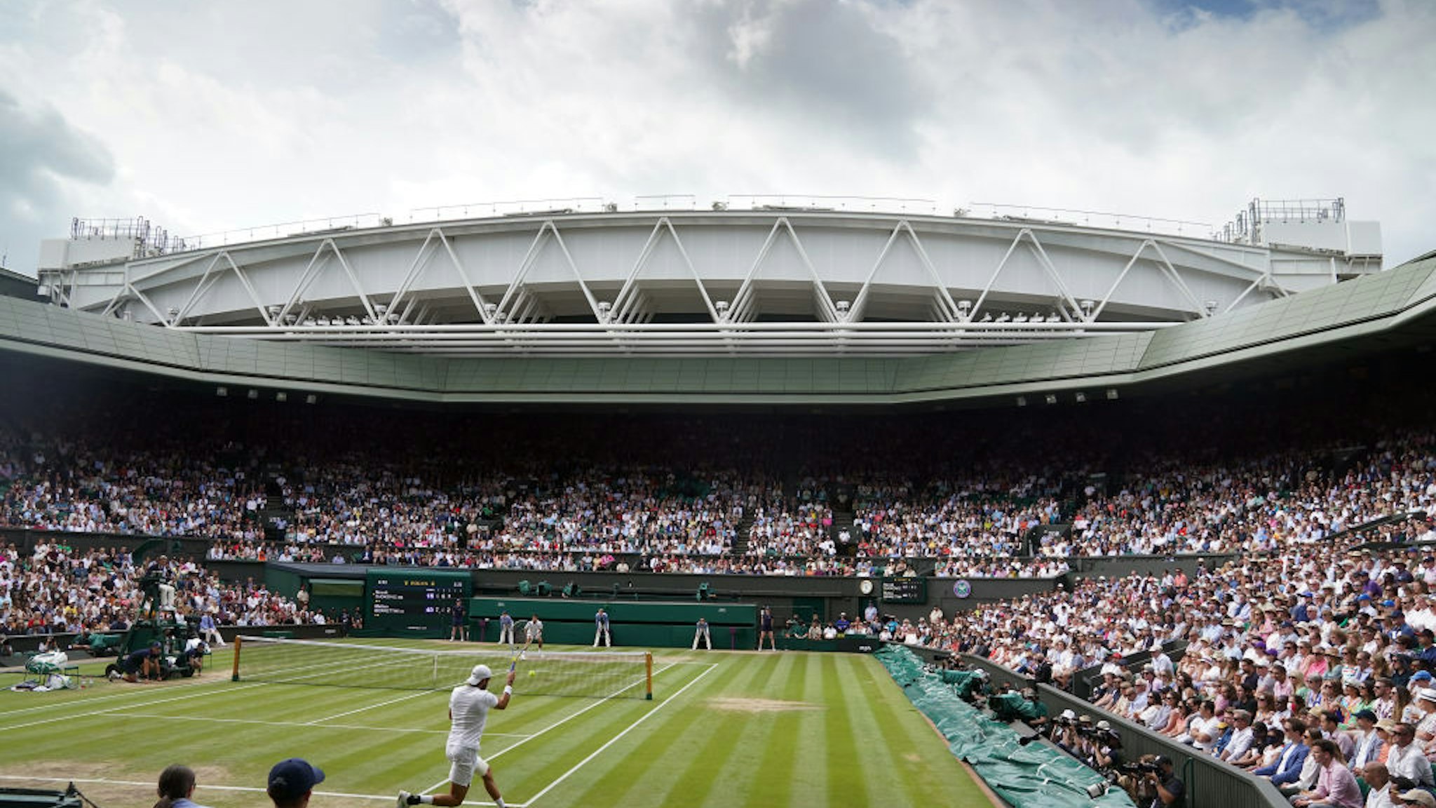 A general view of centre court with Novak Djokovic in action during the Gentlemen's Singles final against Matteo Berrettini (bottom court) on day thirteen of Wimbledon at The All England Lawn Tennis and Croquet Club, Wimbledon. Picture date: Sunday July 11, 2021. (Photo by Adam Davy/PA Images via Getty Images)