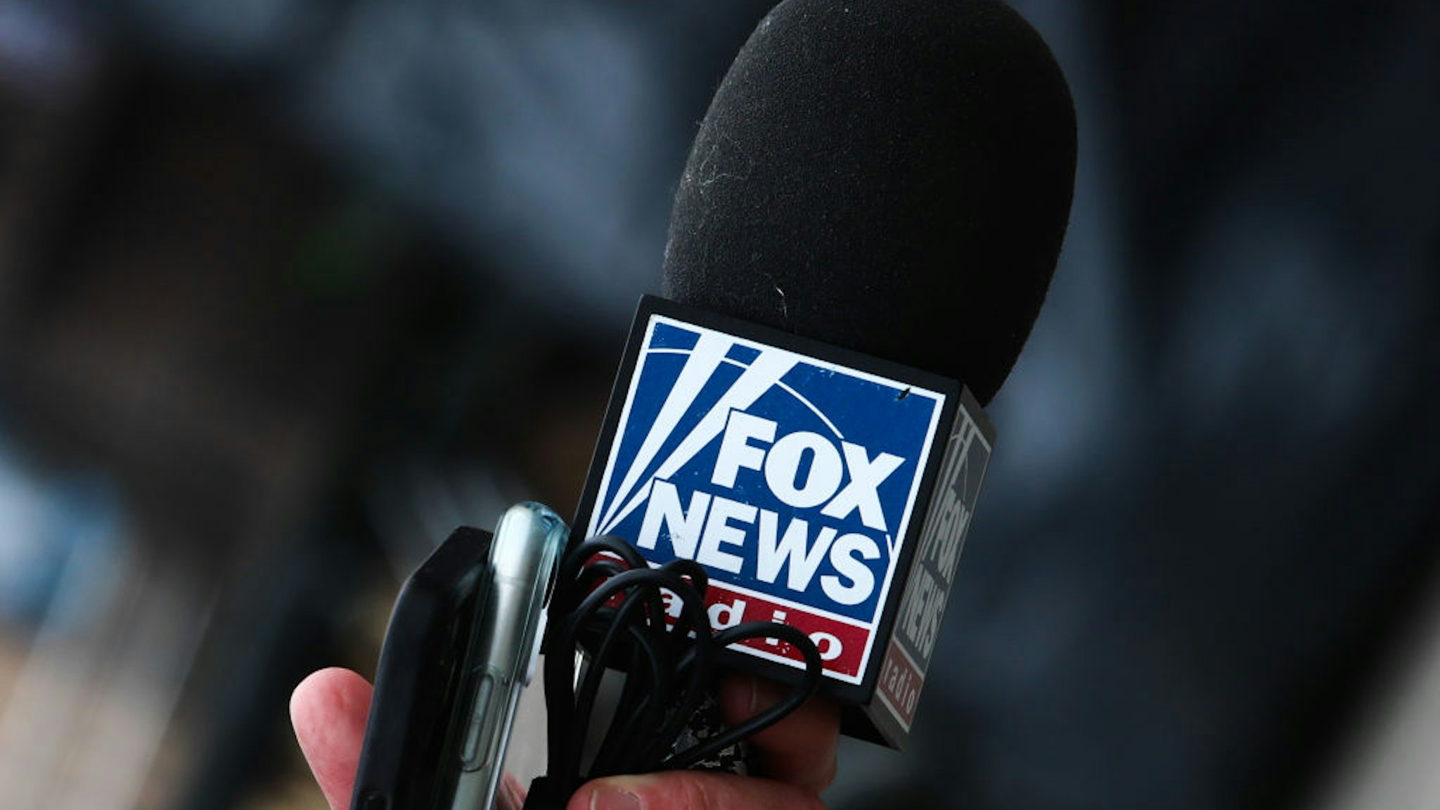 Fox News logo is seen on a reporter's microphone in Przemysl, Poland on March 5, 2022.
